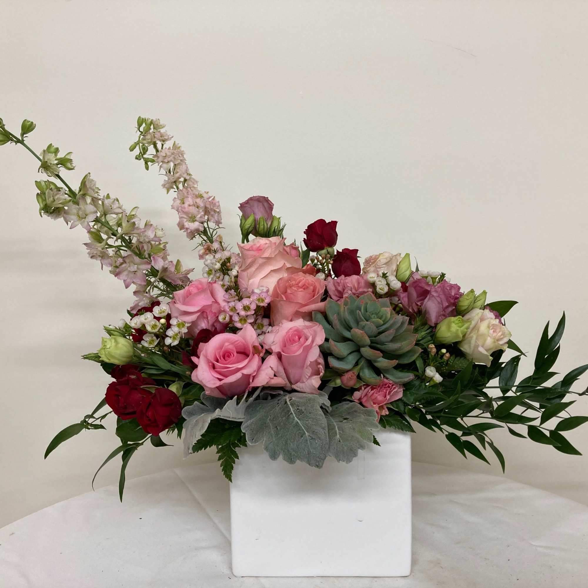 Pink and red roses with succulent
