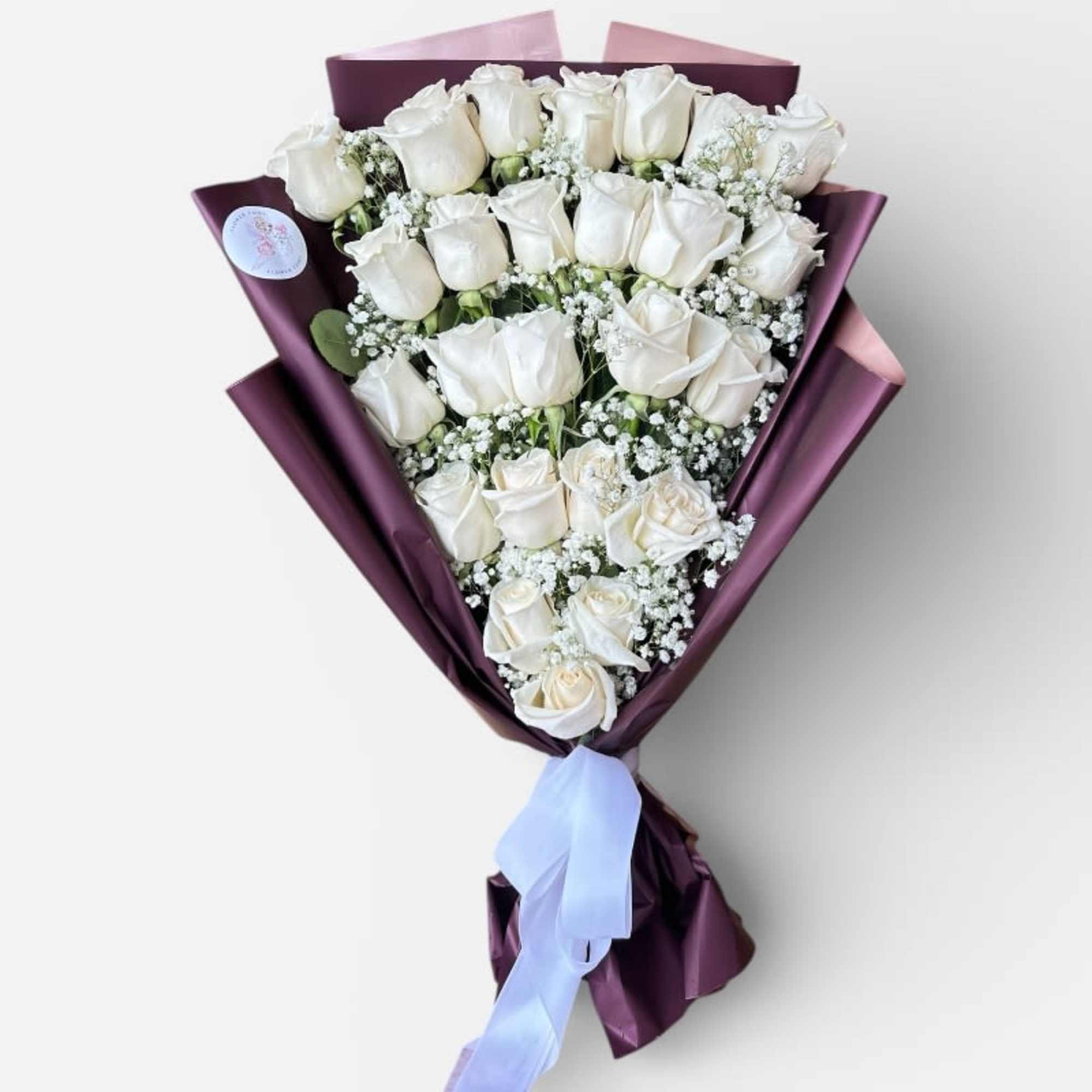 The Timeless Elegance Rose Bouquet is a classic floral arrangement designed to