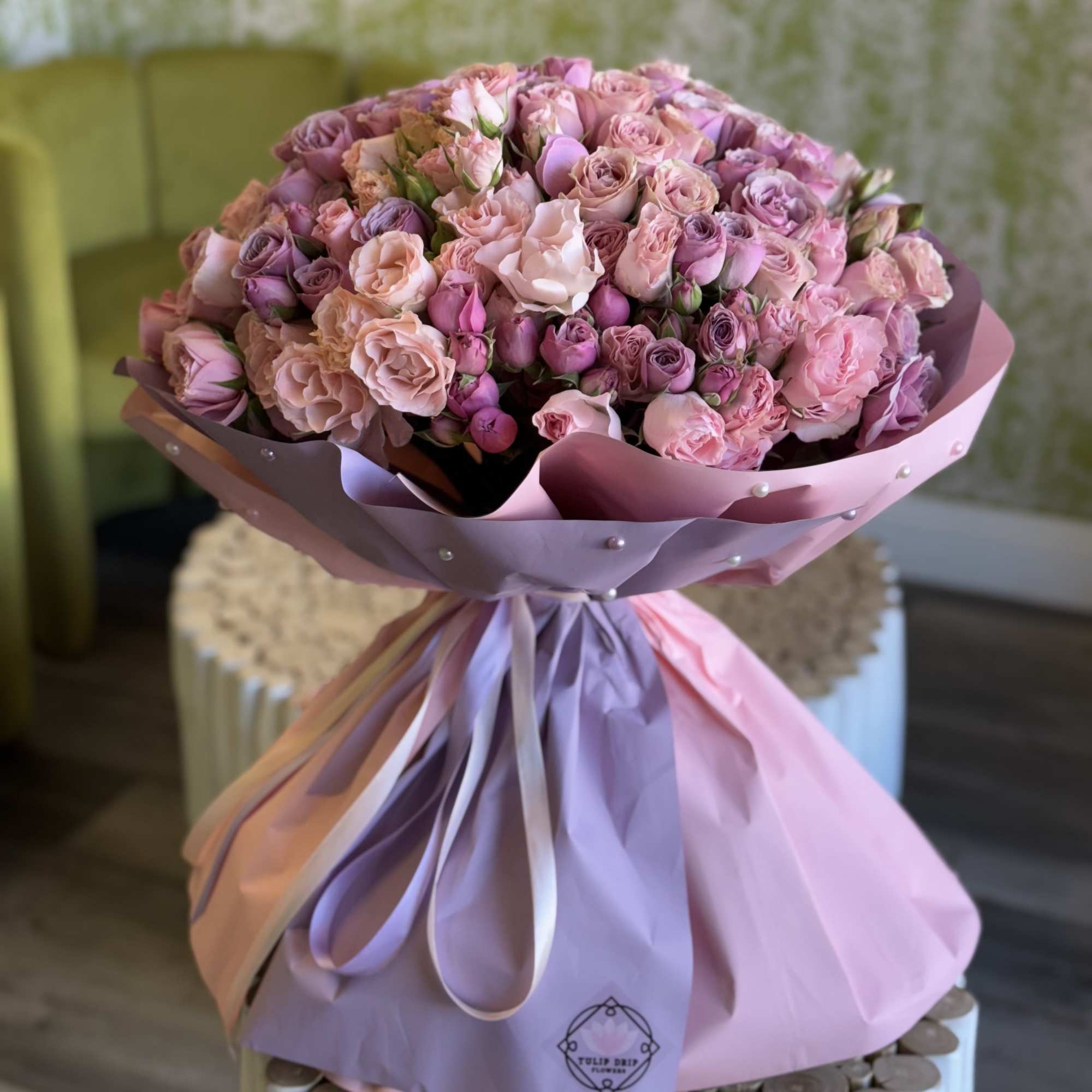 This beautiful bouquet of premium spray roses wrapped in luxurious pastel paper