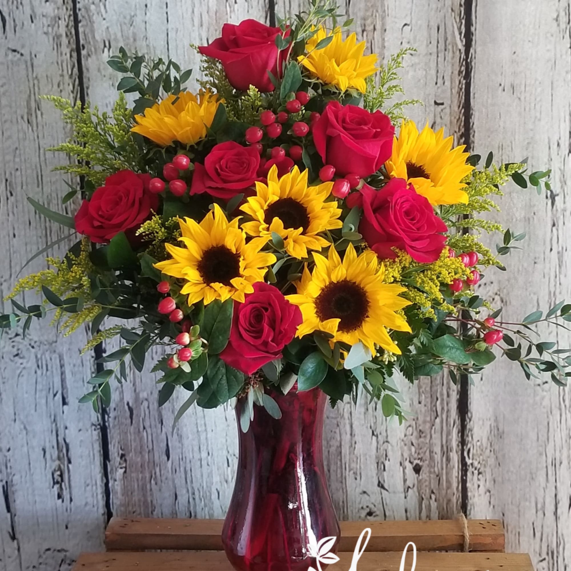 Sunflowers and roses! One of our most popular bouquets.