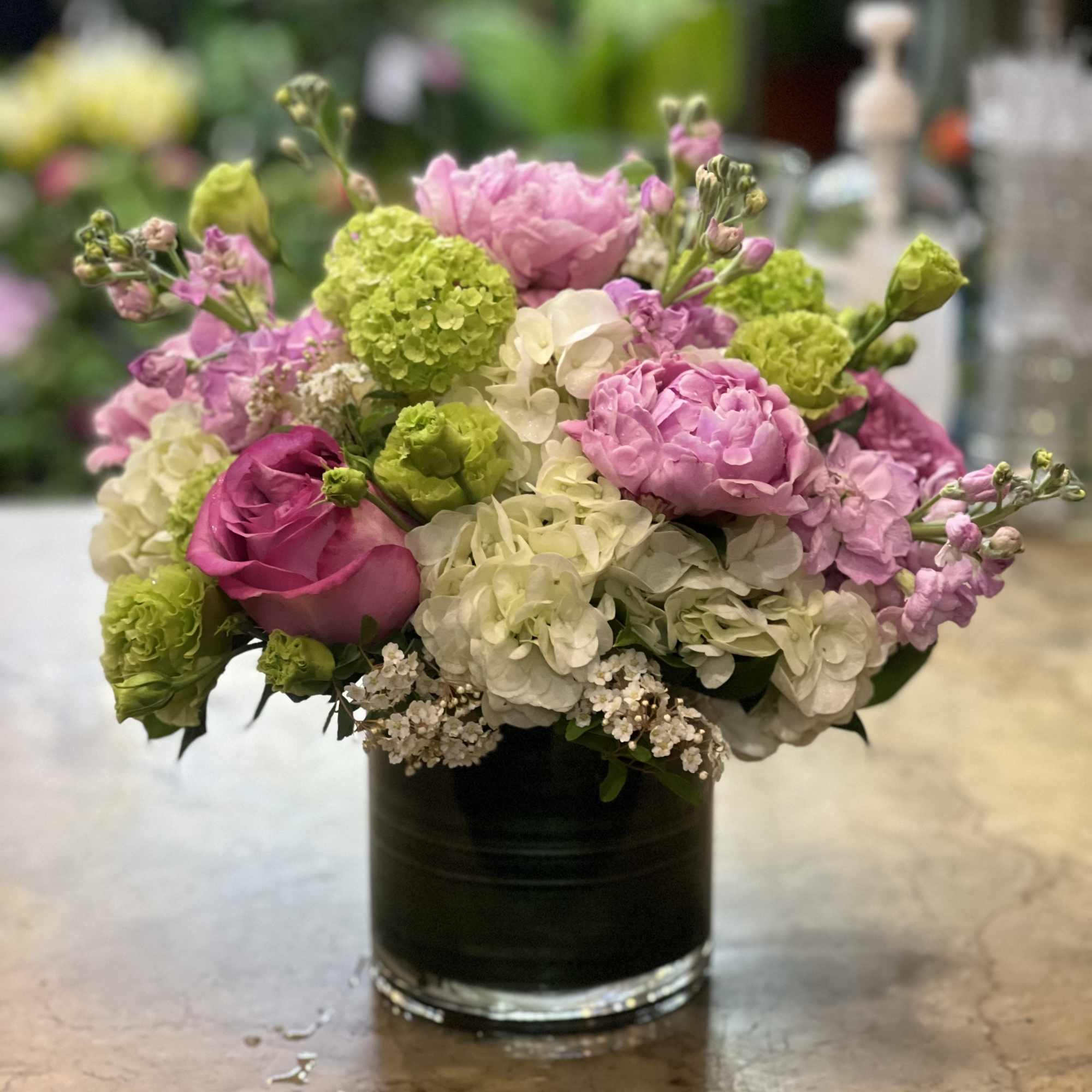 Brighten someone's day with this cheerful bouquet. This arrangement includes roses and