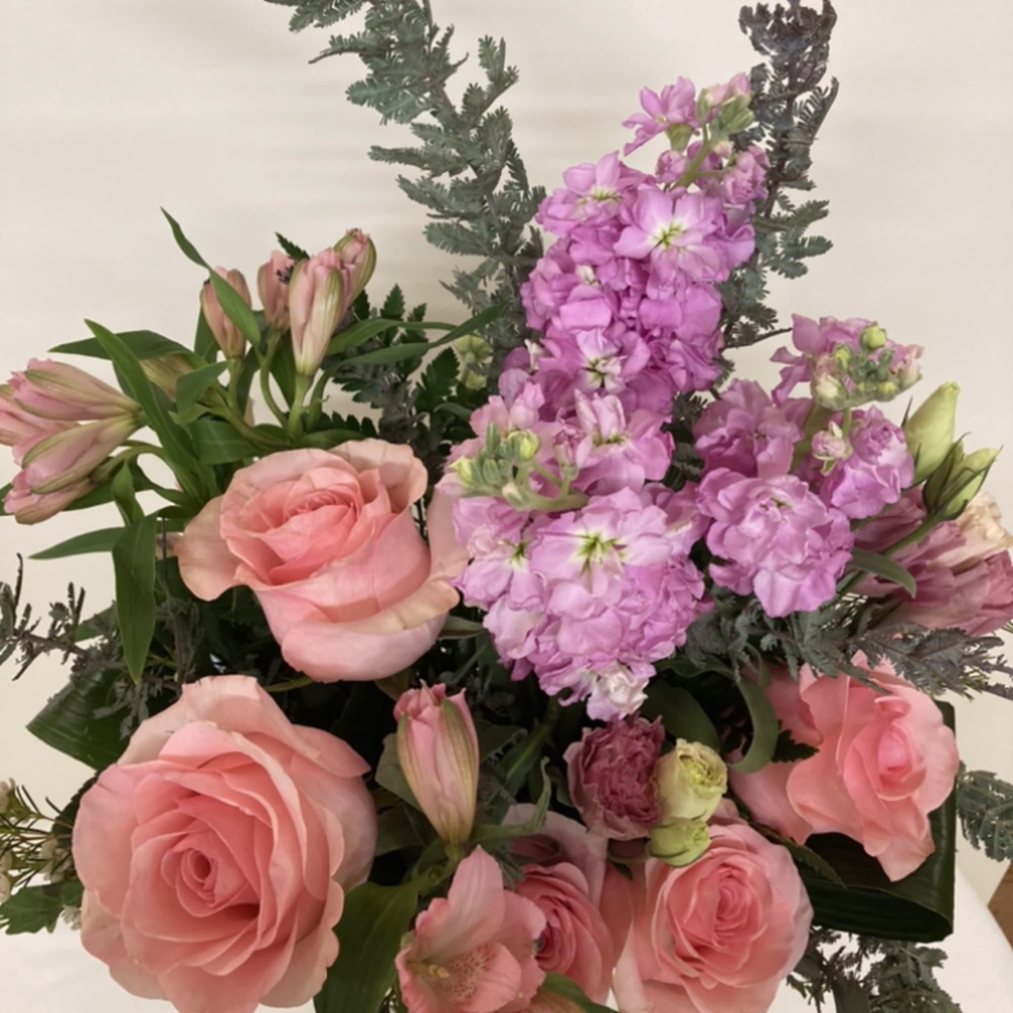 Roses, alstromeria, and stock in pinks