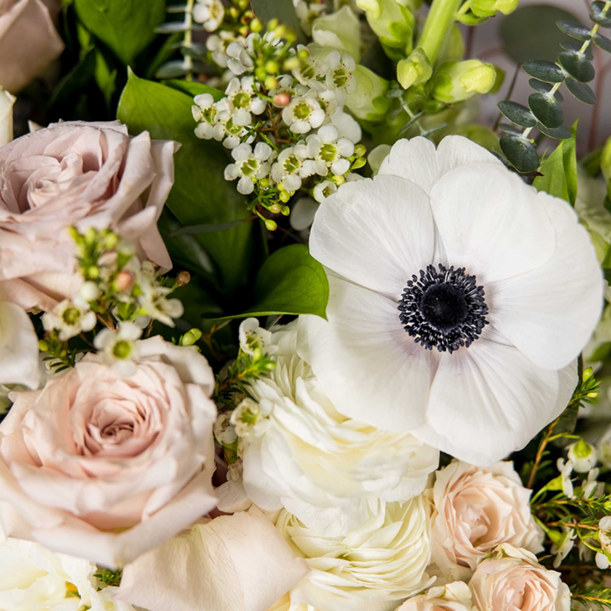 Designed in-house with a serene palette of seasonal neutral flowers. This exquisite