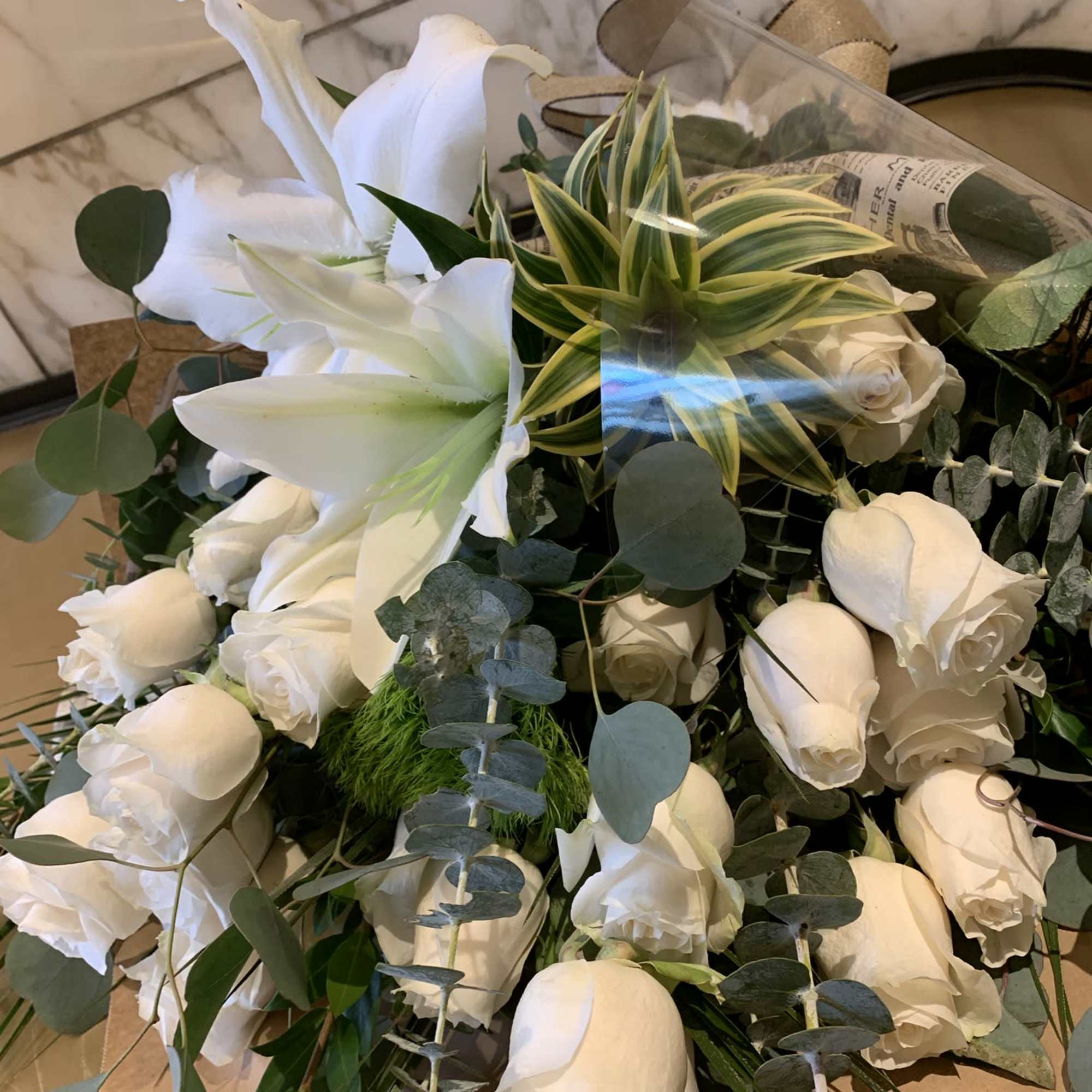 Dozen white roses in a beautiful wrapped presentacion