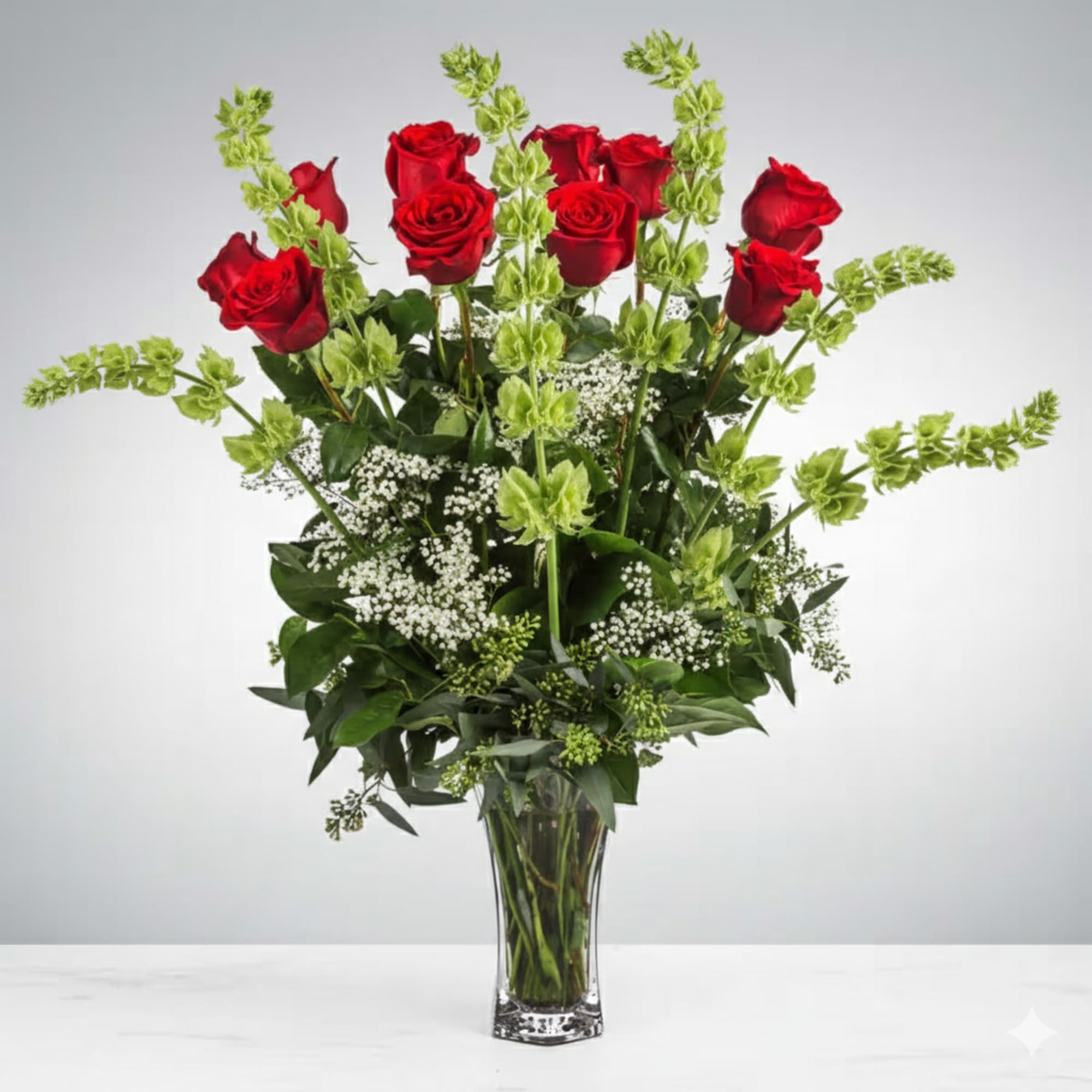 These dozen red roses with baby's breath are classic! Perfect romantic gift