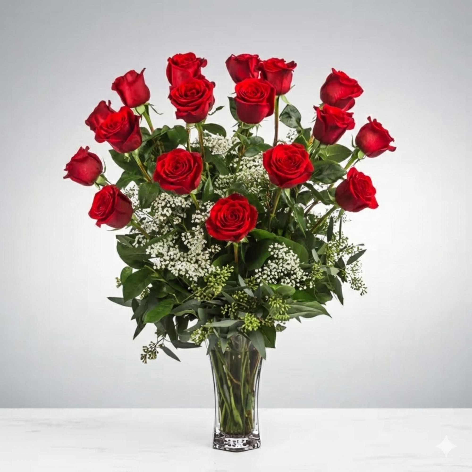 These dozen red roses with baby's breath are classic! Perfect romantic gift
