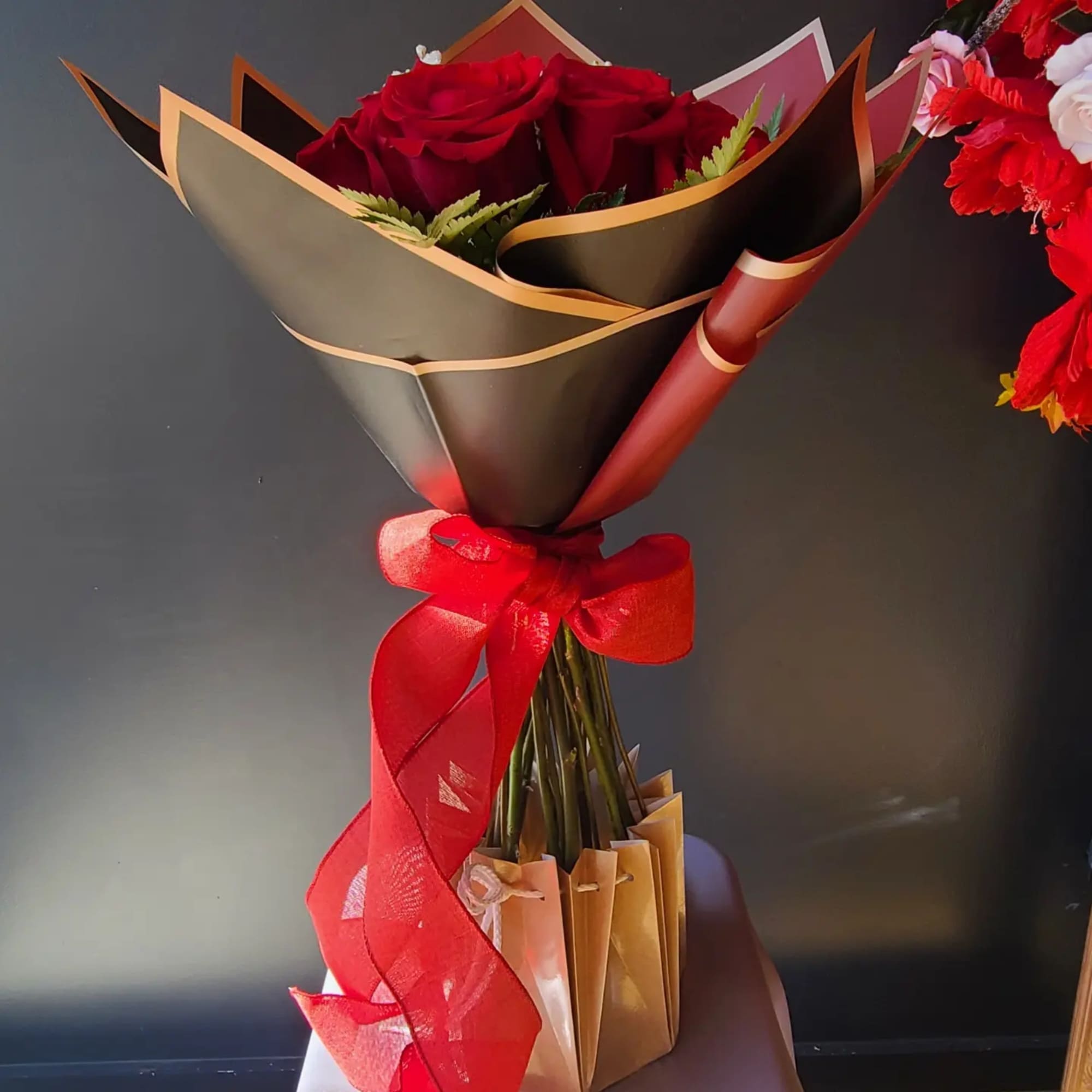 Enchanting Red and White roses are put together to create this modern
