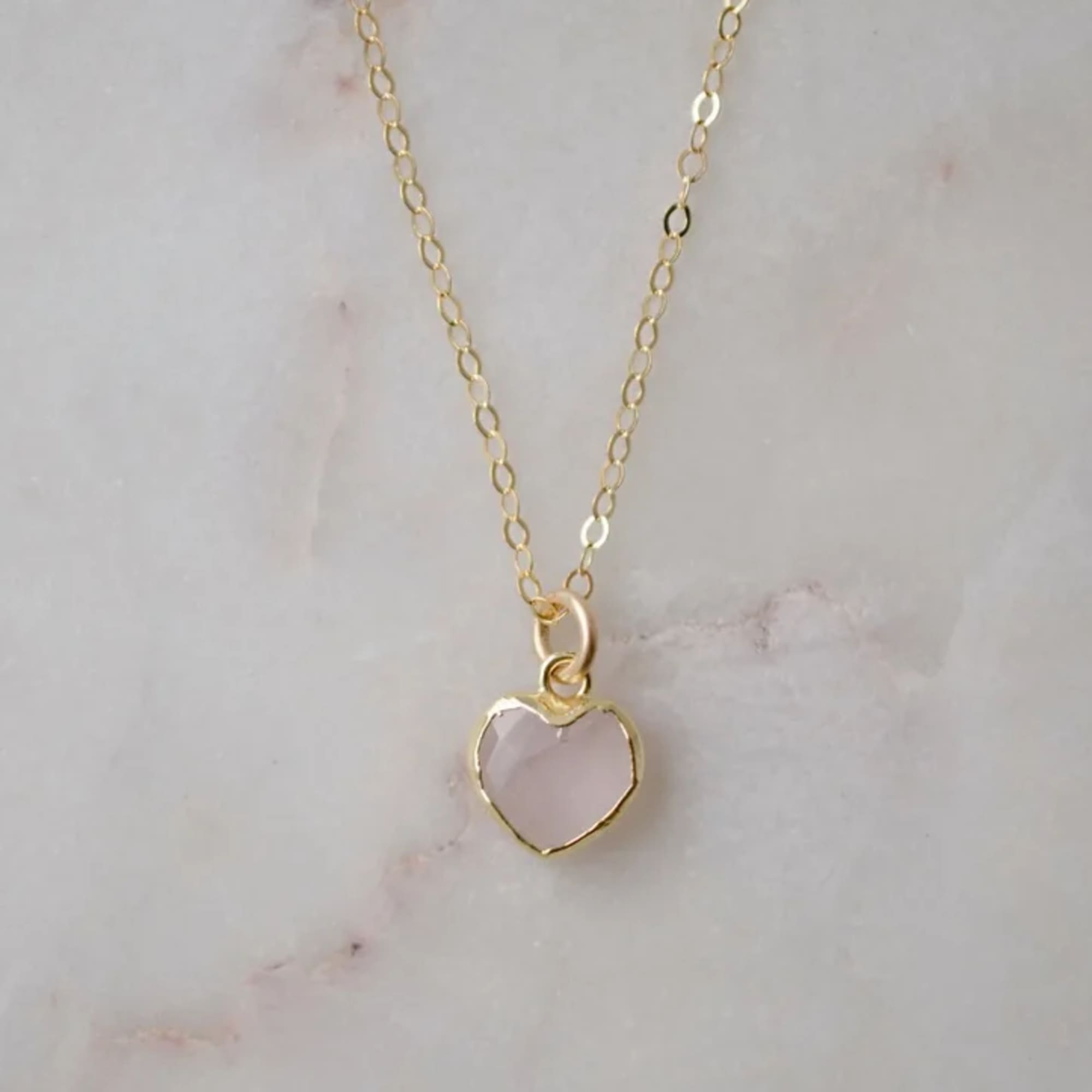 Crafted from 14k gold filled and natural Rose Quartz, this pendant is