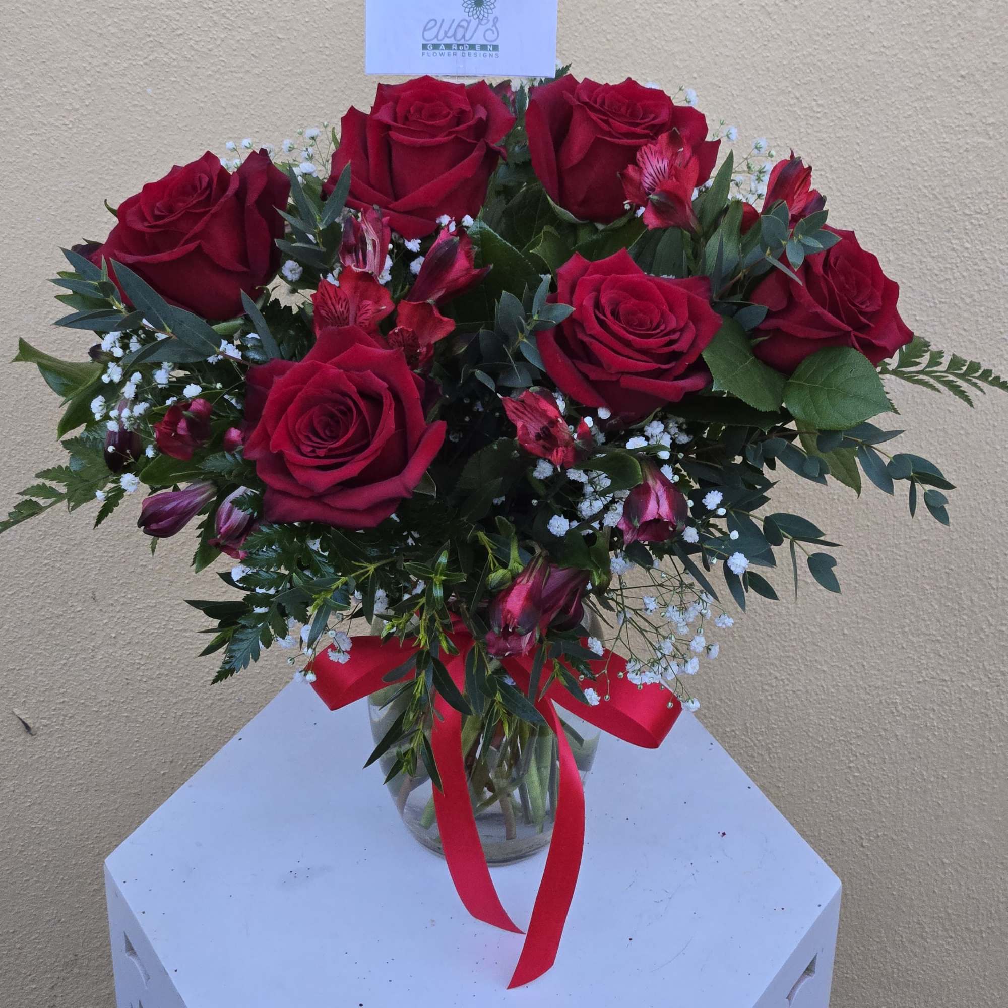 Beautiful crystal vase arrangement with 6 red roses, red alstroemeria, baby's breath