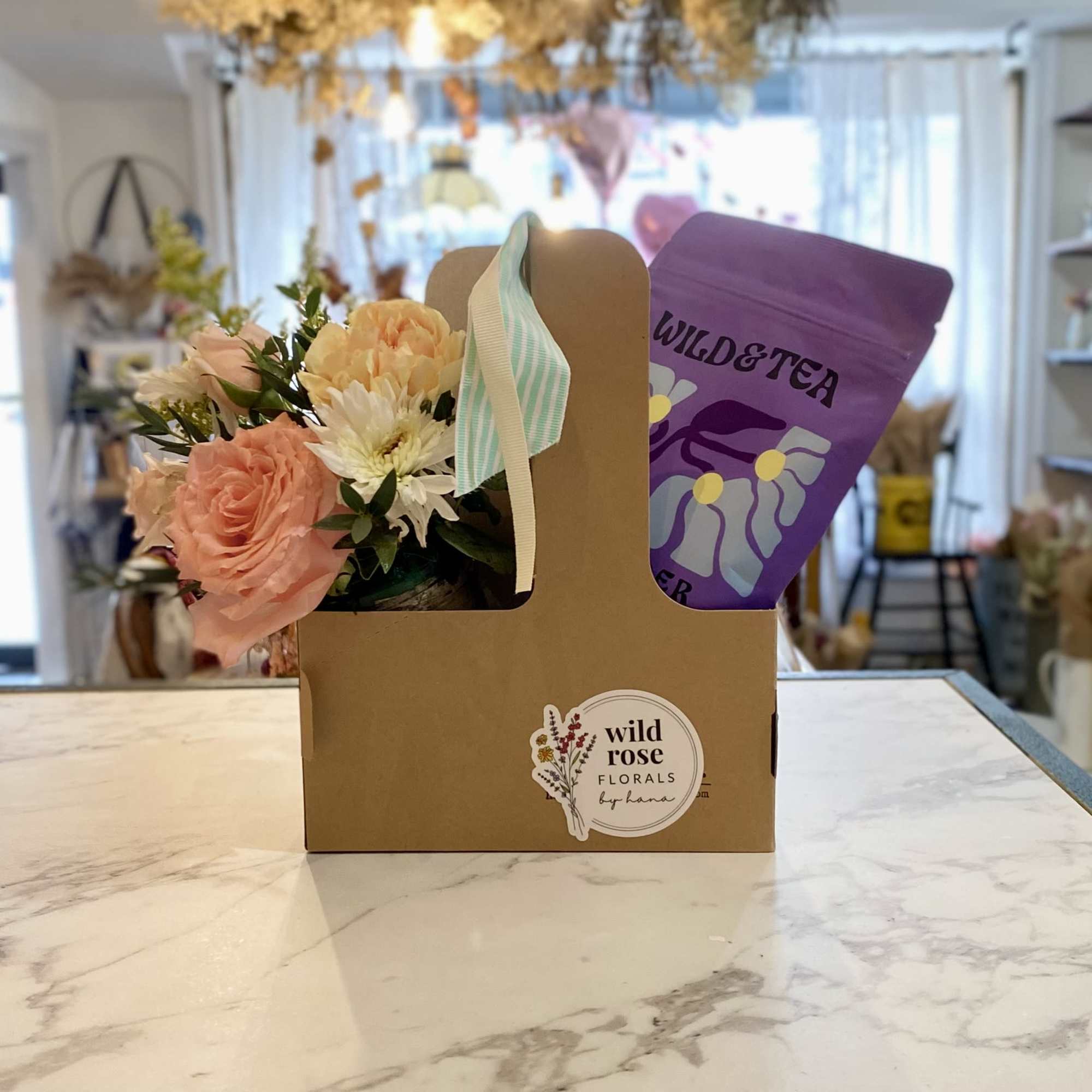 A Flower arrangement and Tea set is a perfect gift for any