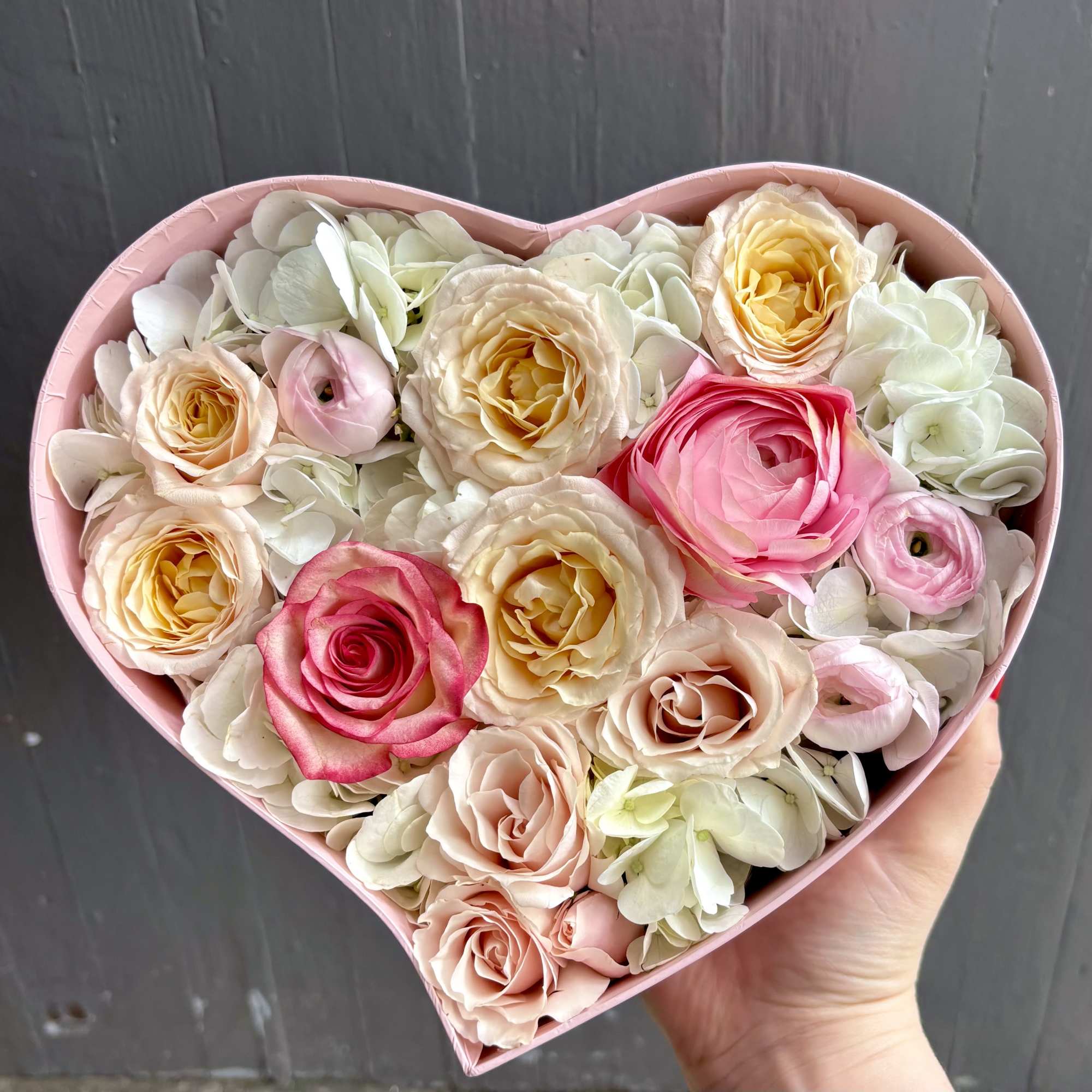 A beautiful mix of whites, peaches, and light pinks perfectly arranged in