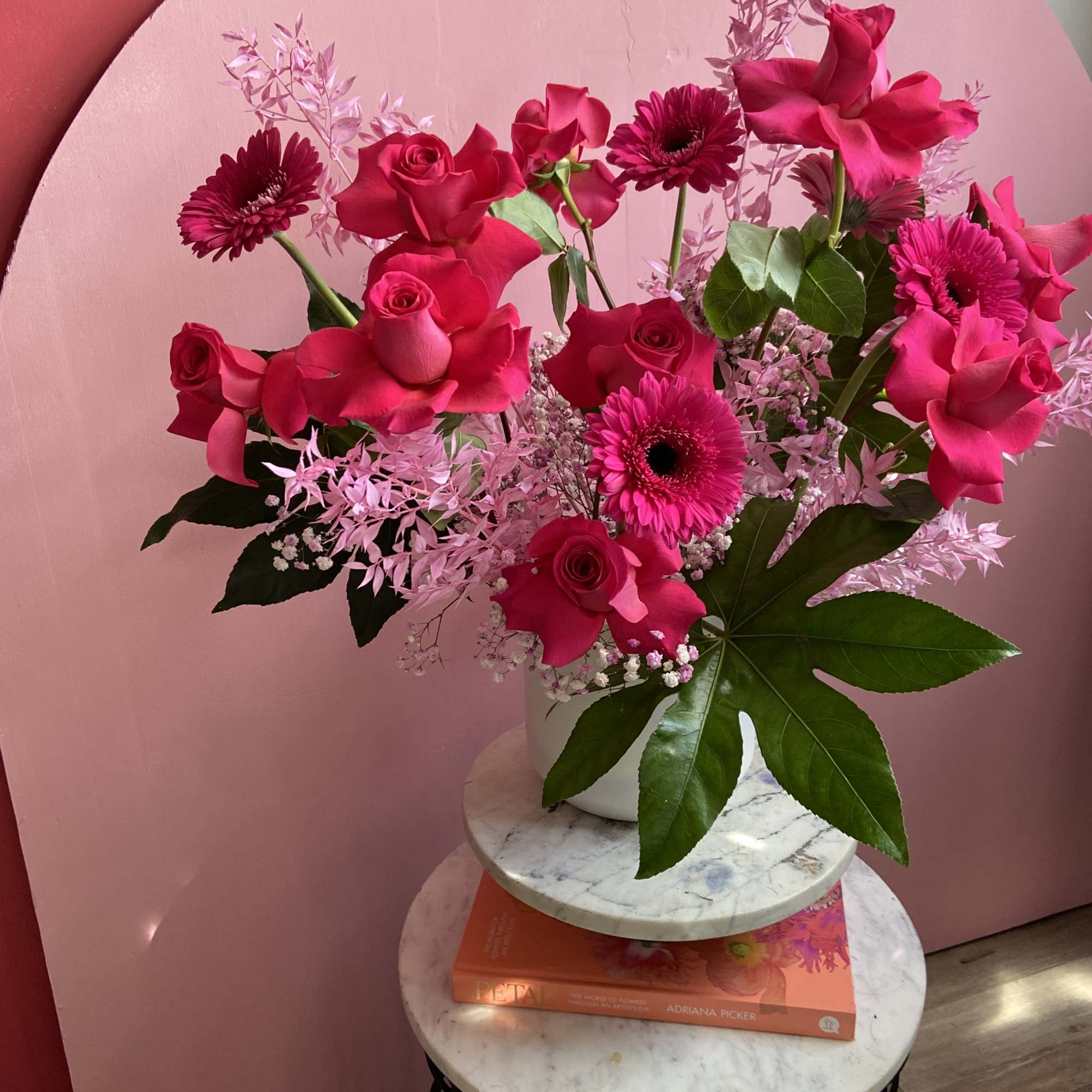 Pink Monochromatic statement piece bursting with Pink Floyd roses, Gerber daisies, and