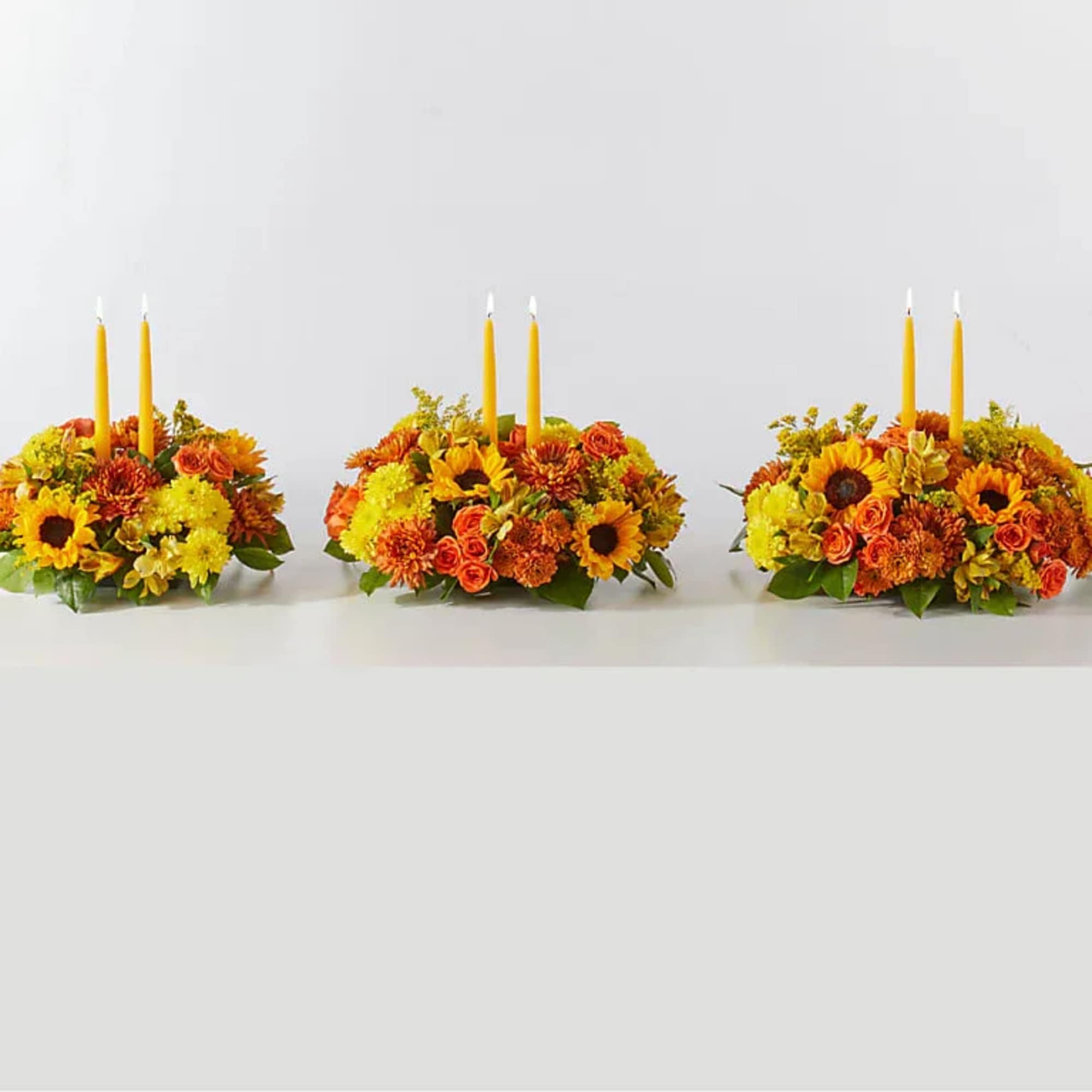 Enjoy a candlelit dinner with this colorful arrangement that embraces every shade