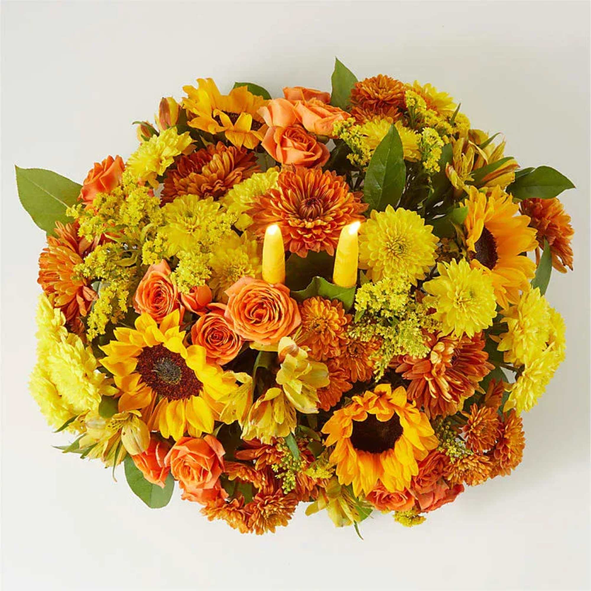 Enjoy a candlelit dinner with this colorful arrangement that embraces every shade
