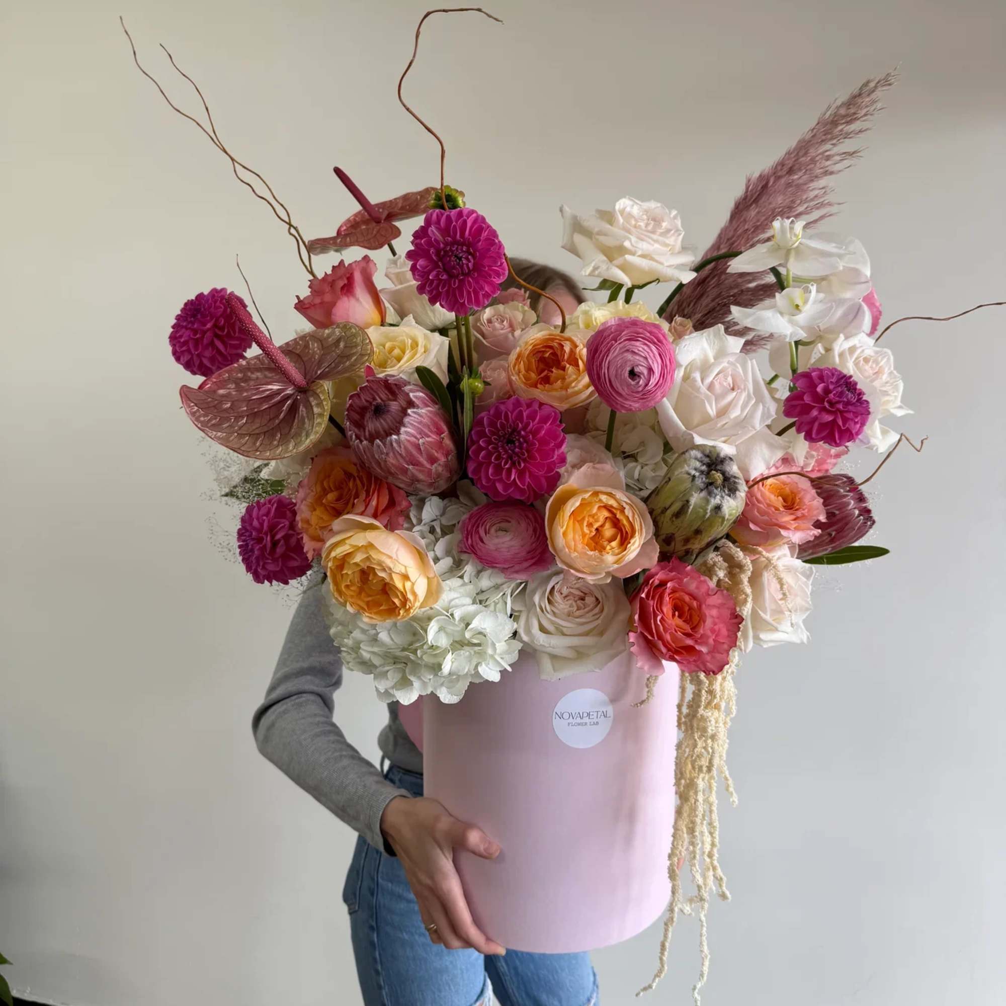 Discover the artistry of NovaPetal with our One-of-a-Kind Hat Box Arrangement, crafted