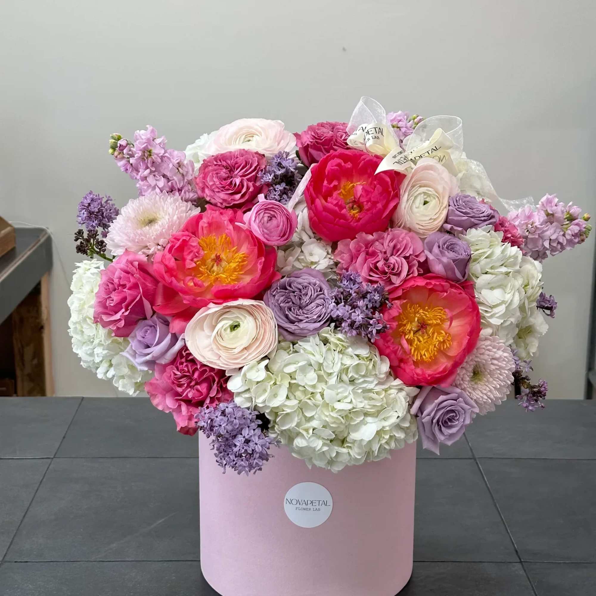 This exquisite floral arrangement is a stunning composition that exudes luxury and