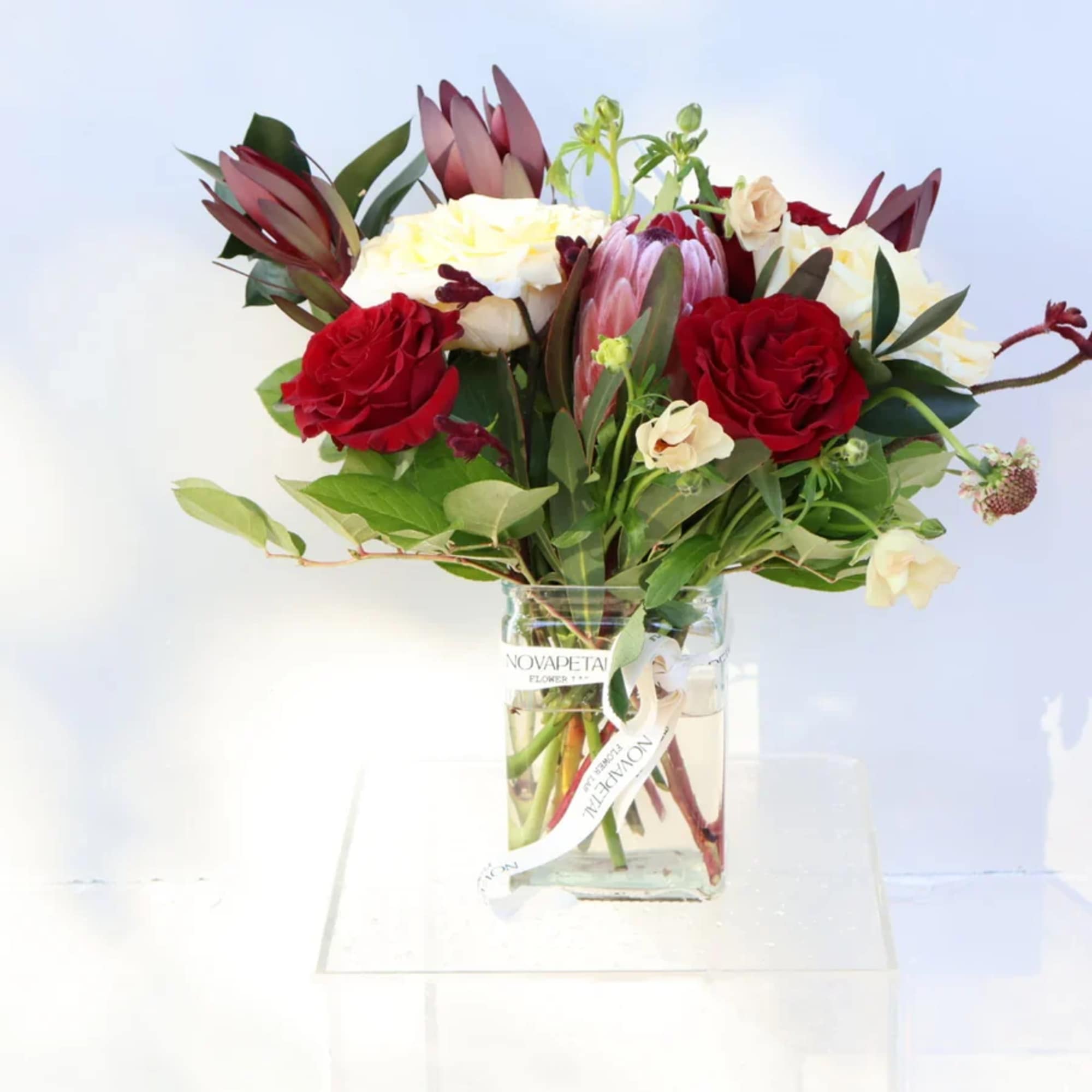 This elegant floral arrangement is a captivating expression of love, perfectly curated