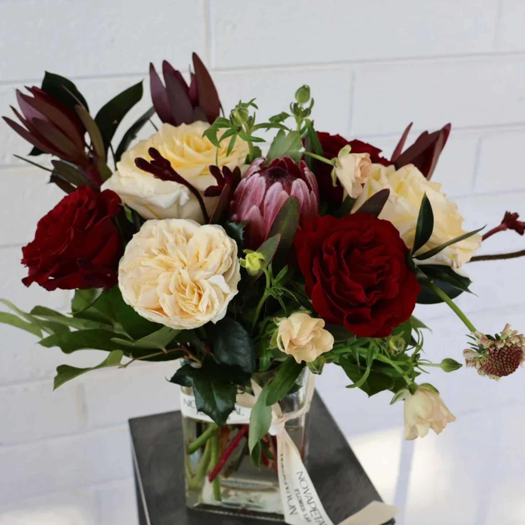 This elegant floral arrangement is a captivating expression of love, perfectly curated