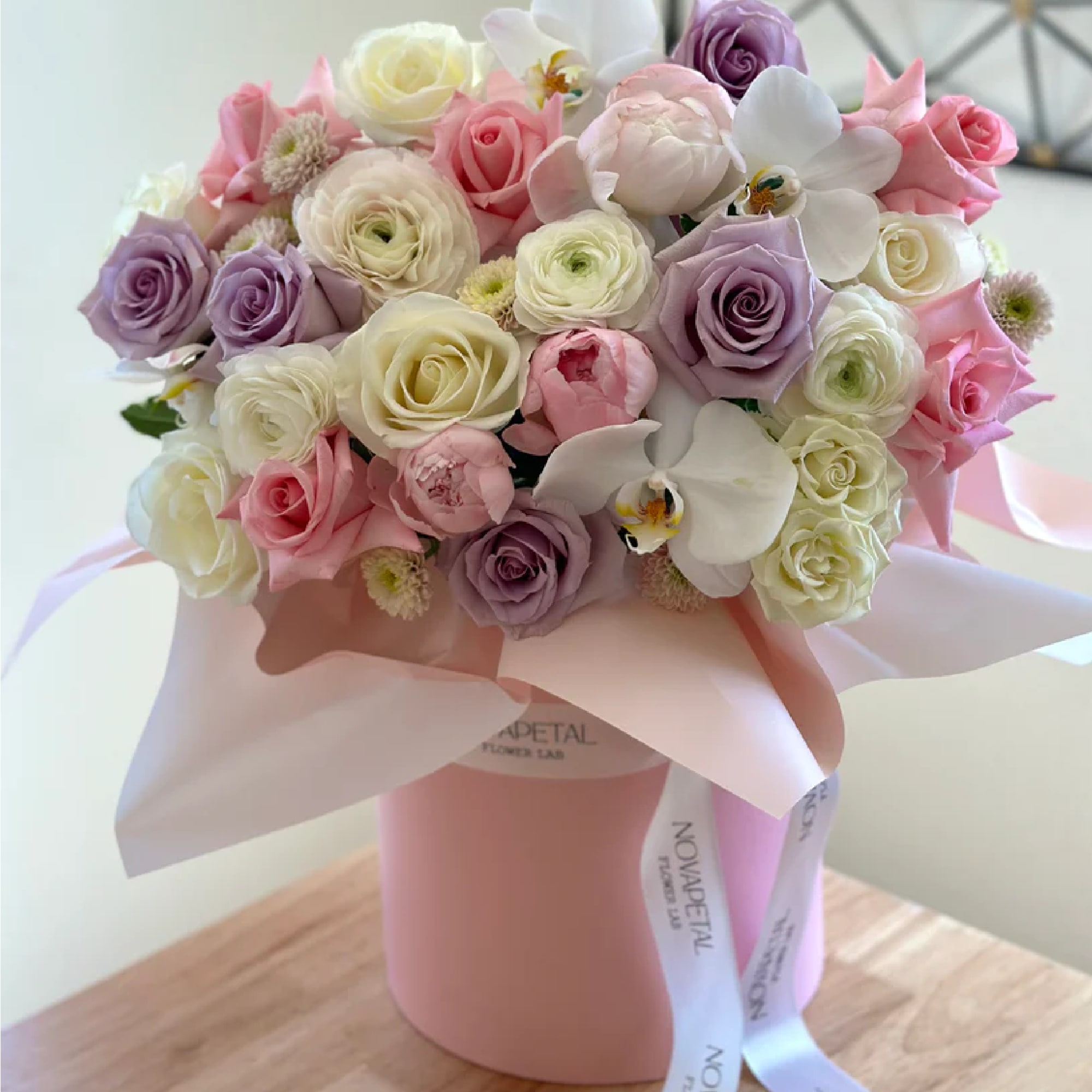 Experience the whimsical sweetness of our Candy Land Box Arrangement, skillfully crafted