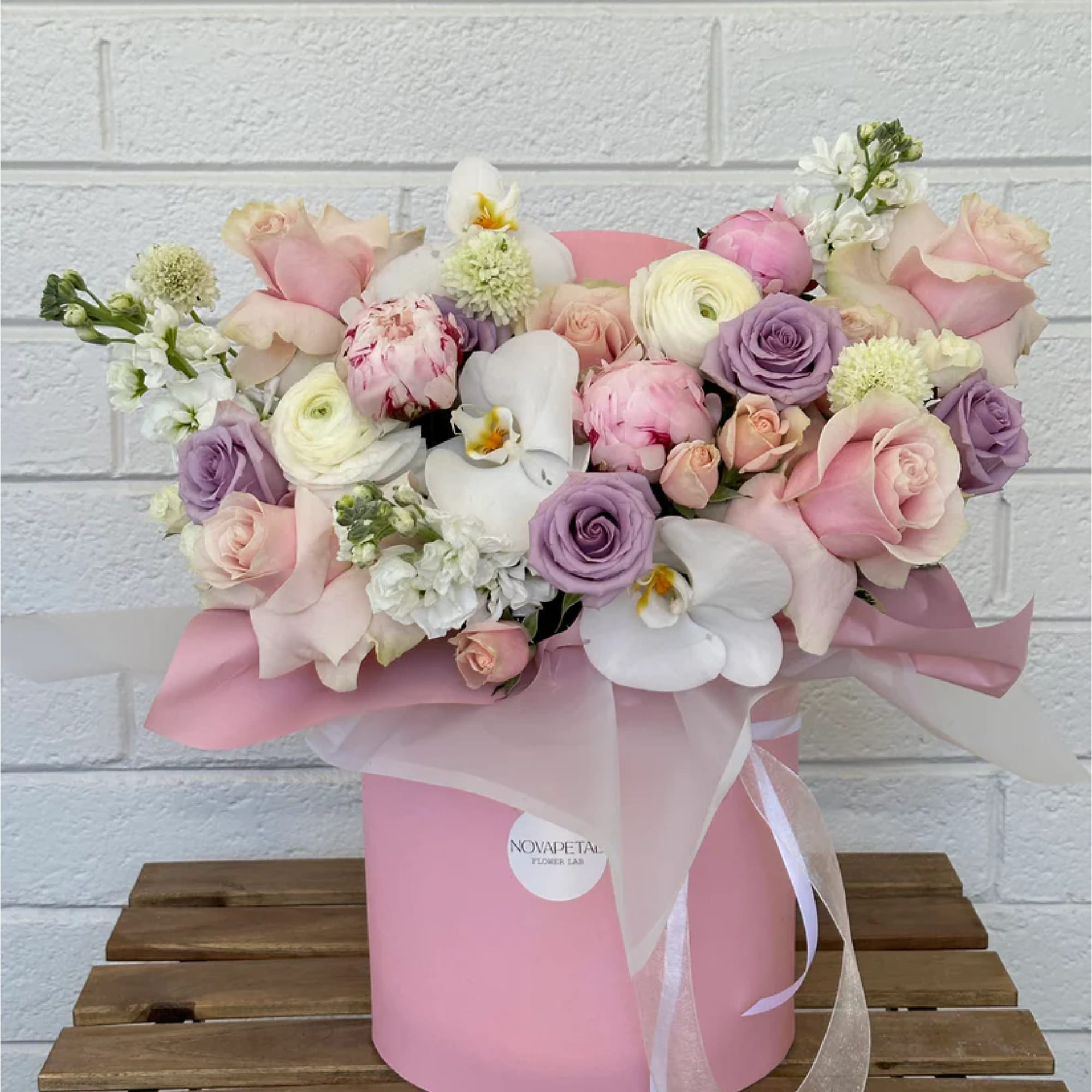 Experience the whimsical sweetness of our Candy Land Box Arrangement, skillfully crafted