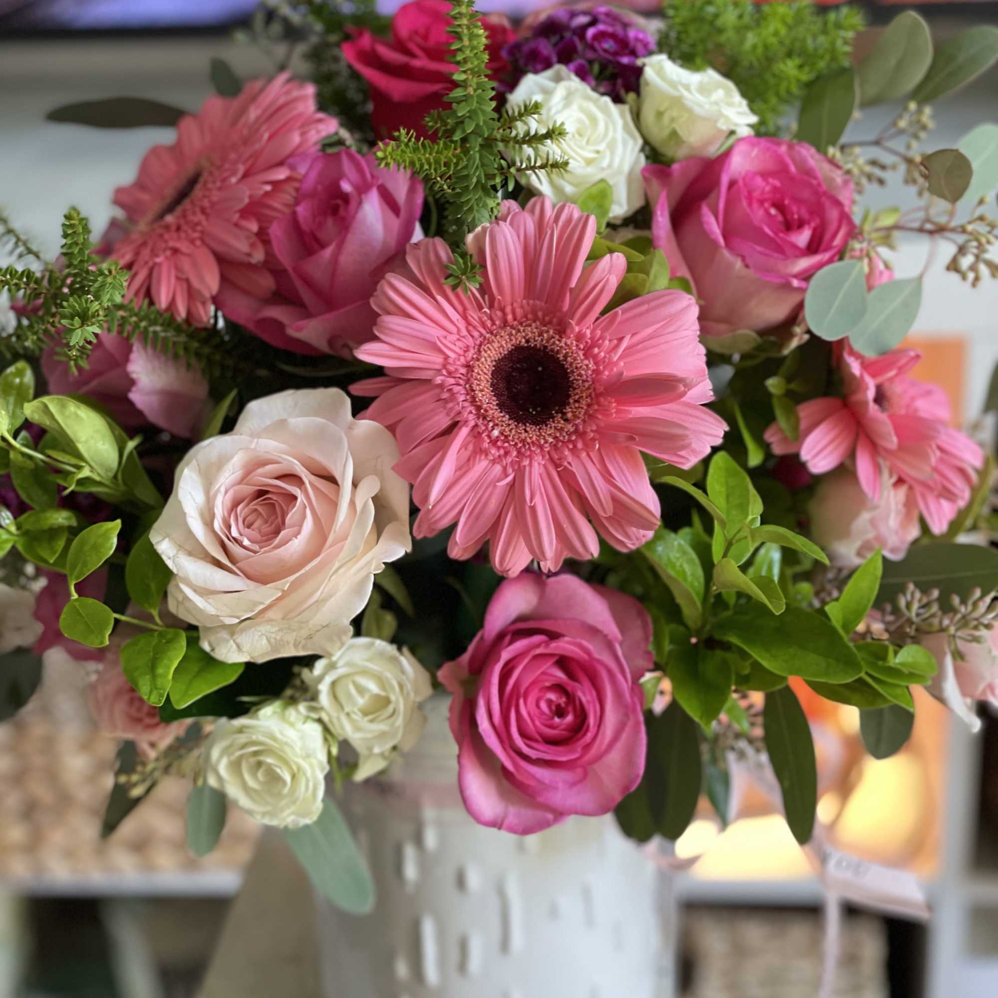 Vibrant pinks, roses, seasonal fillers and pretty greenery. 