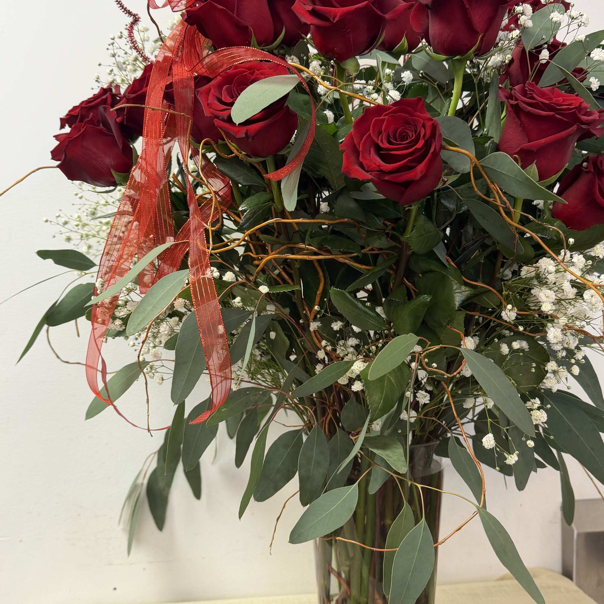  luxury Explorer Red Roses with a touch of curly willow and
