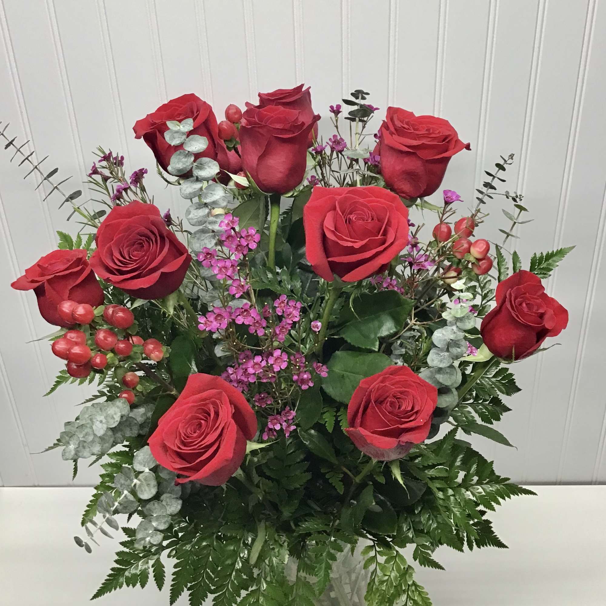 Classic dozen red roses with wax flower, blupurom and iucalipto