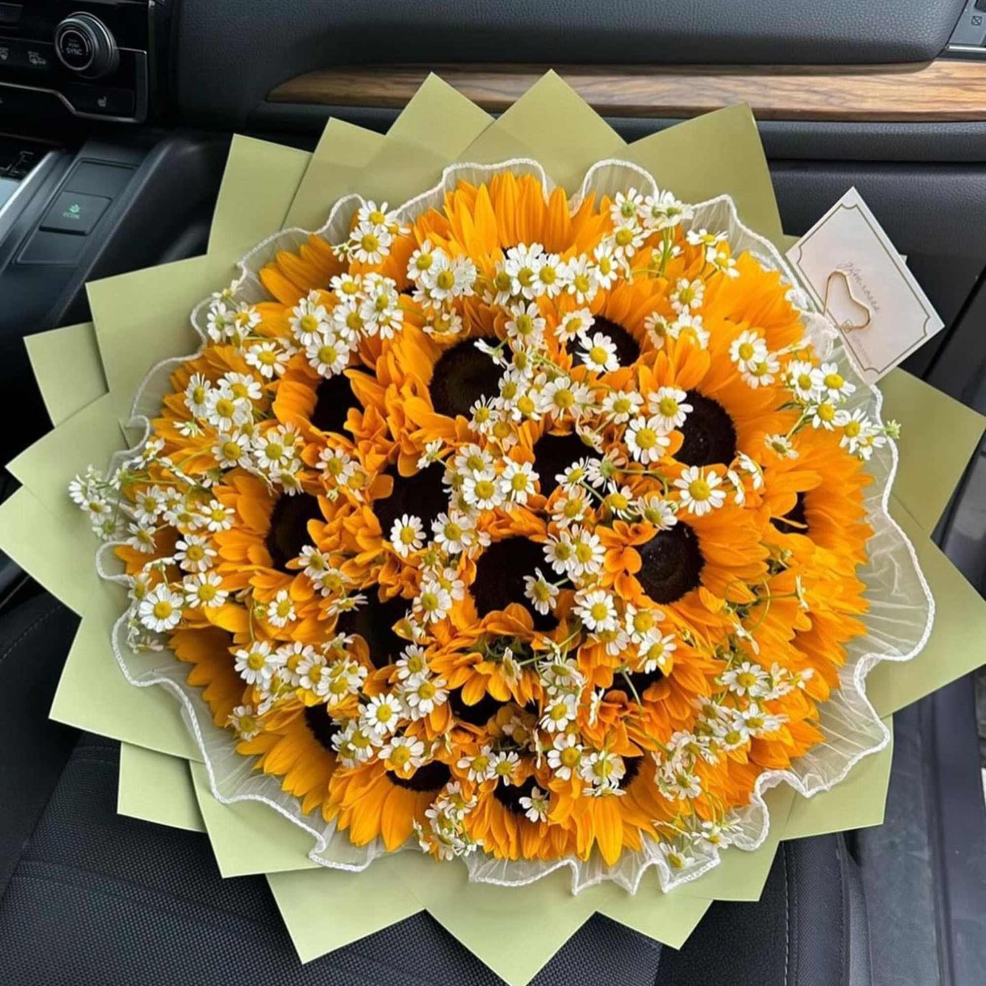 beautiful bouquet of 30 sunflowers with chamonile or baby"s breath.
