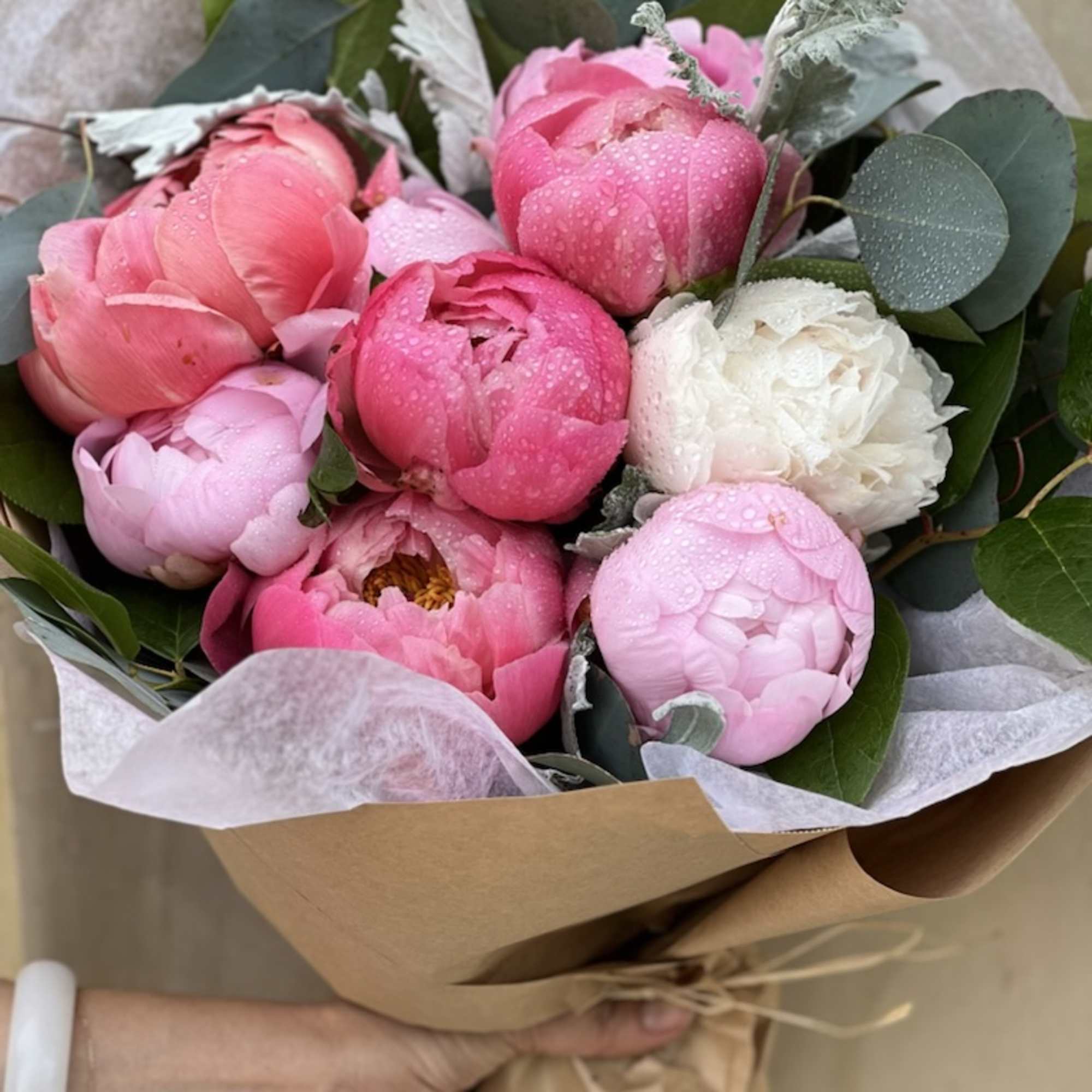 Peonies wrapped in brown paper, Which Inadvertently shows elegance and romance. besides
