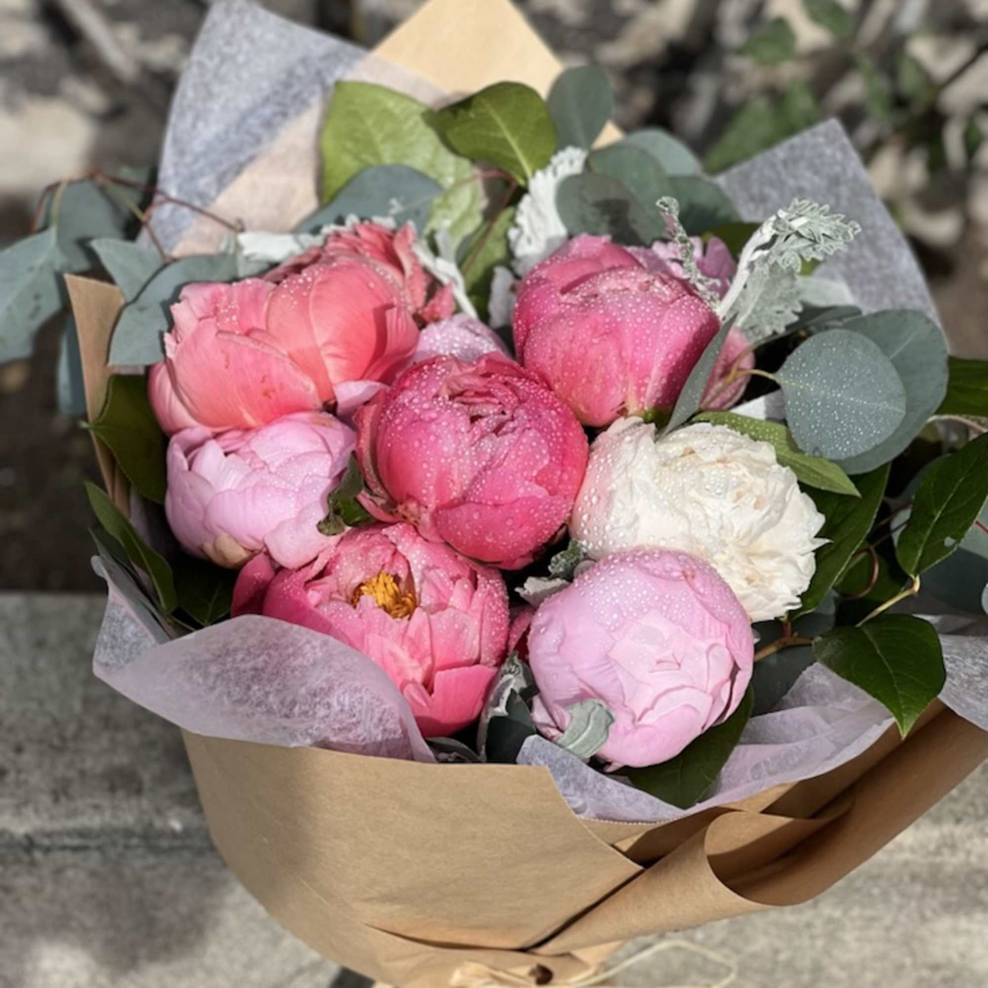 Peonies wrapped in brown paper, Which Inadvertently shows elegance and romance. besides