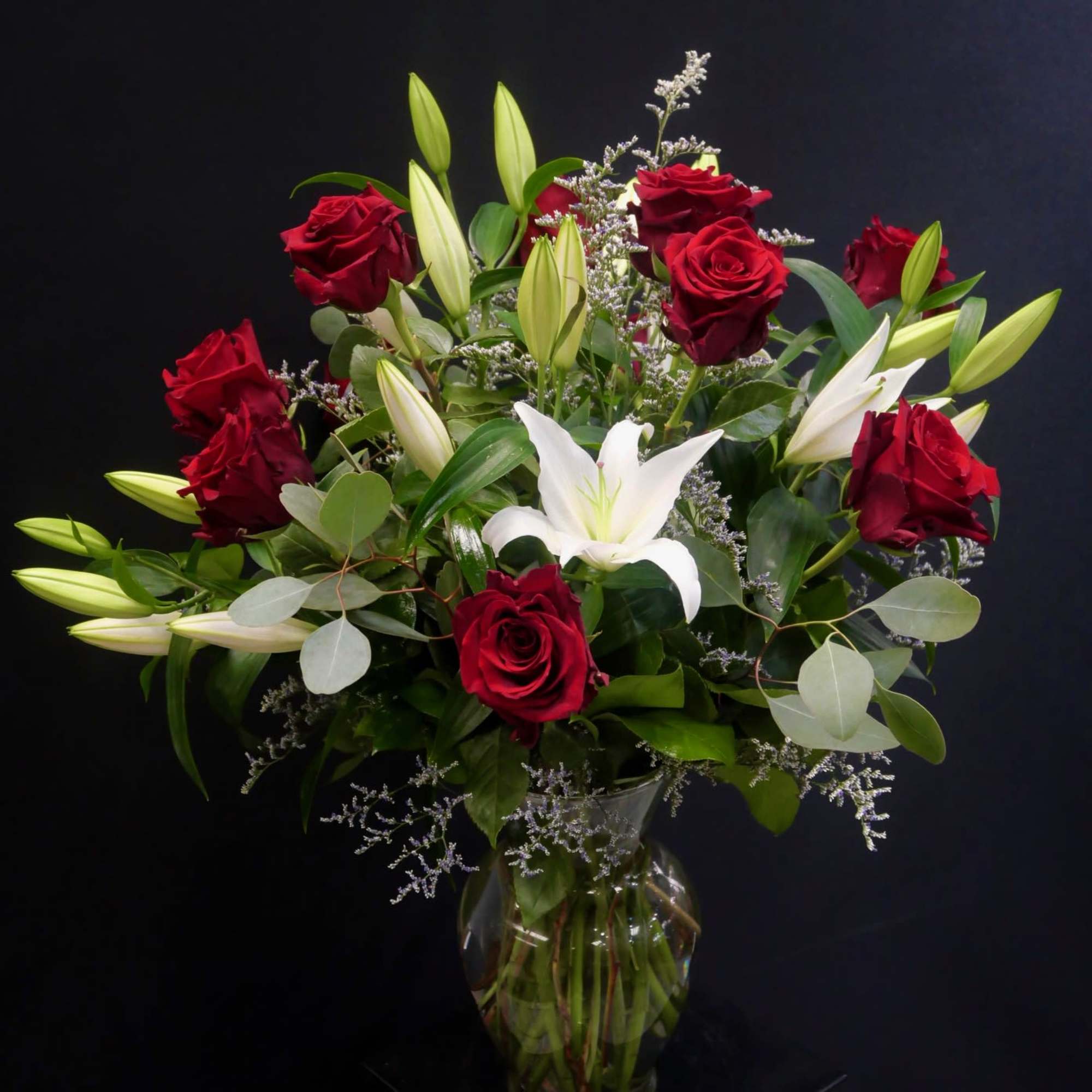 Classic Red roses and pure white or pink lilies are two of