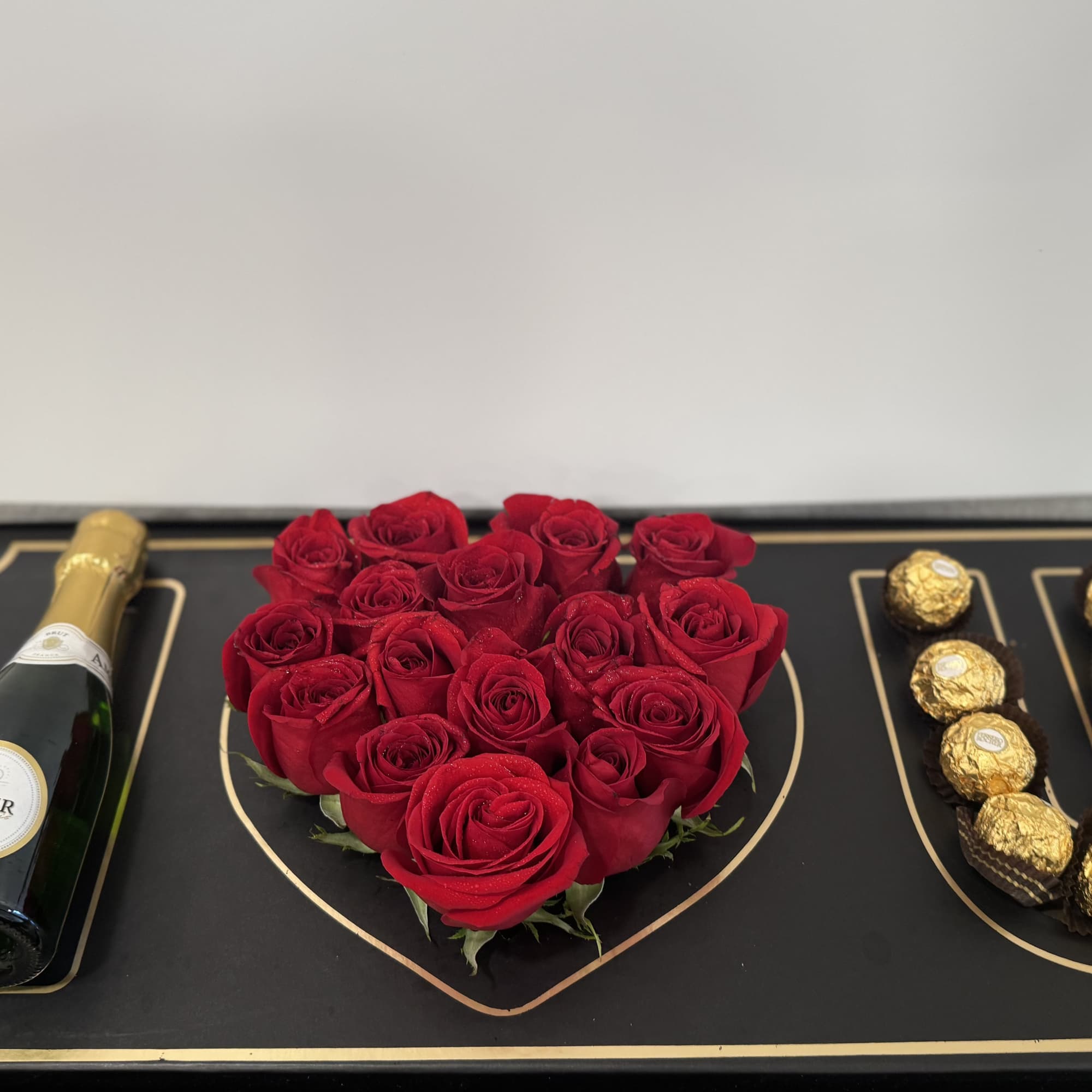 A striking display where each letter is filled with vibrant red roses