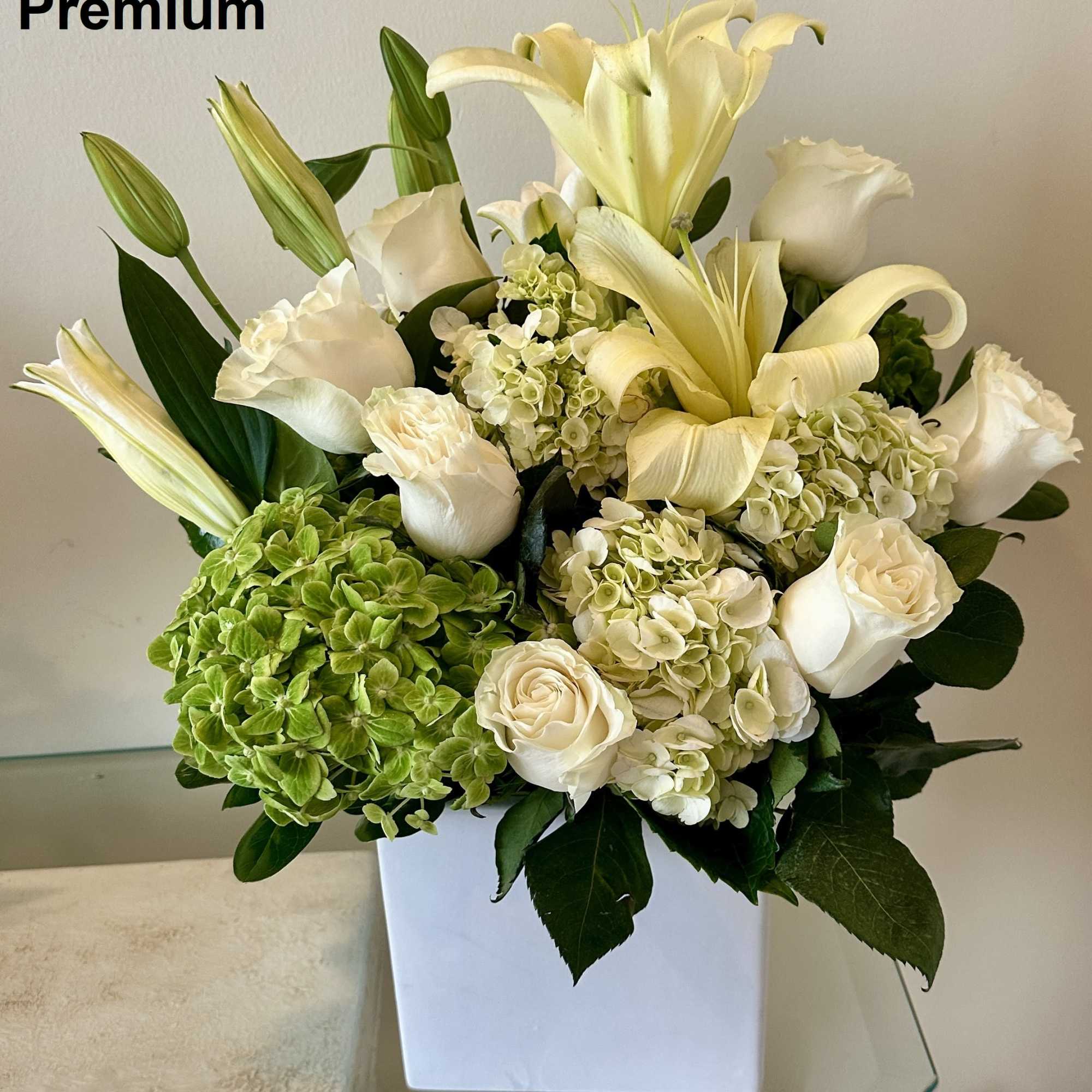 White flowers as shown arranged round in a vase. The quantity of