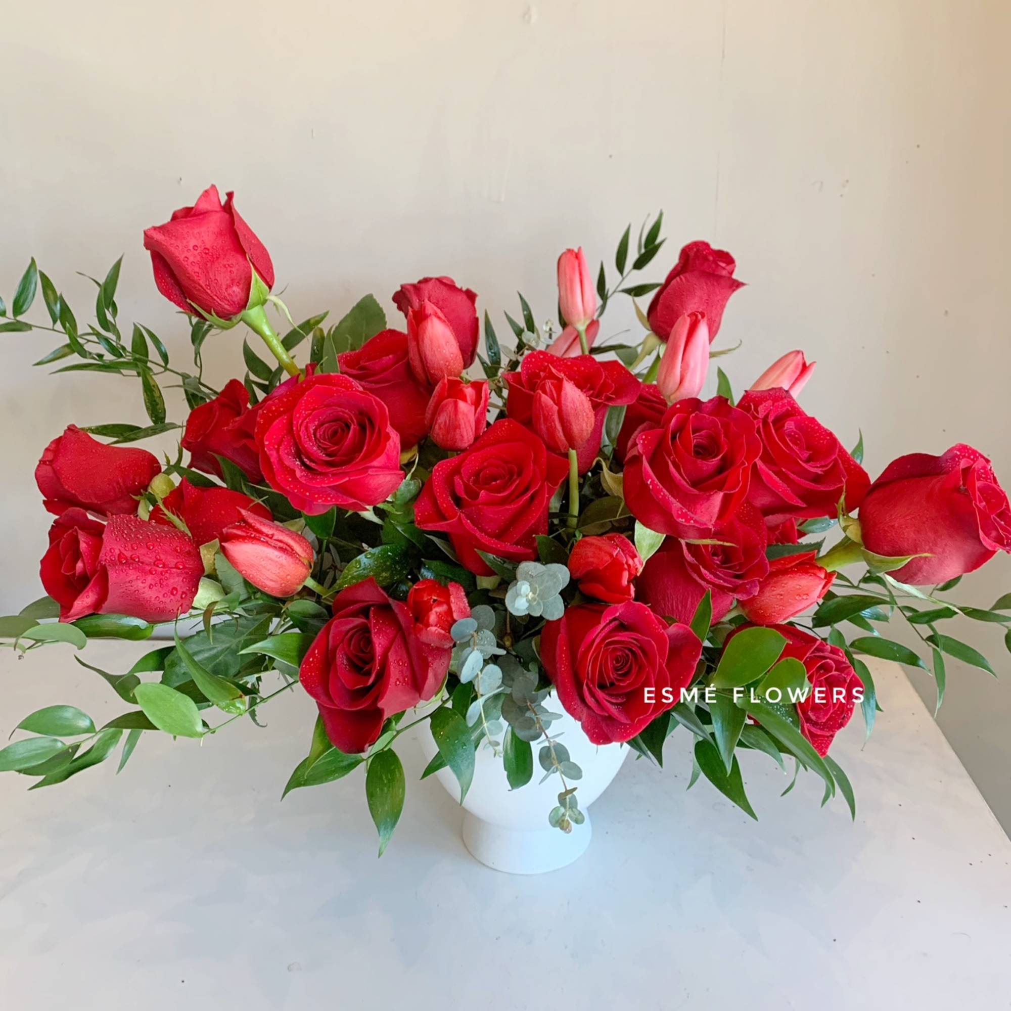 A classic red rose arrangement with a modern twist of elegance. The