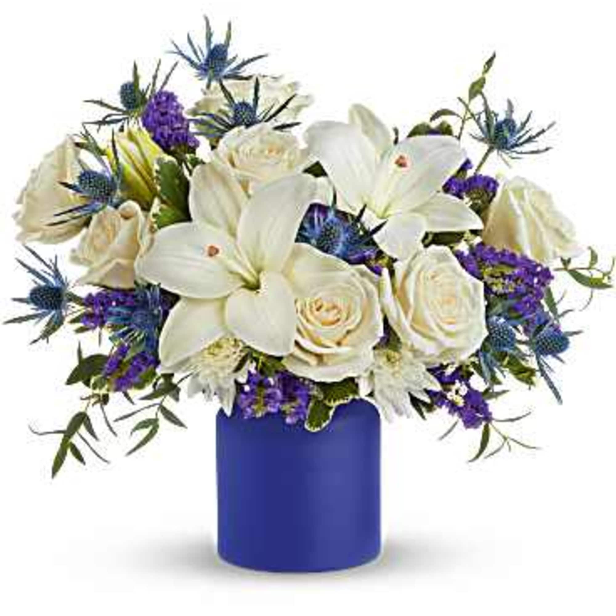 A beautiful expression of tranquility, Teleflora's Blue Harmony Bouquet features lush white