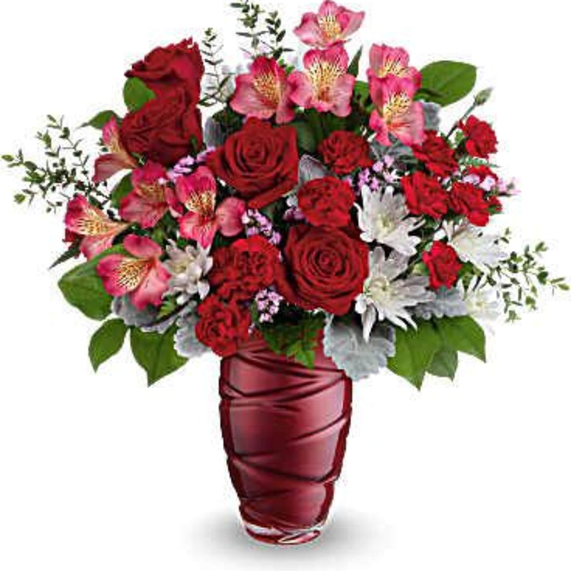 A keepsake deep red swirl vase filled with an assortment of roses