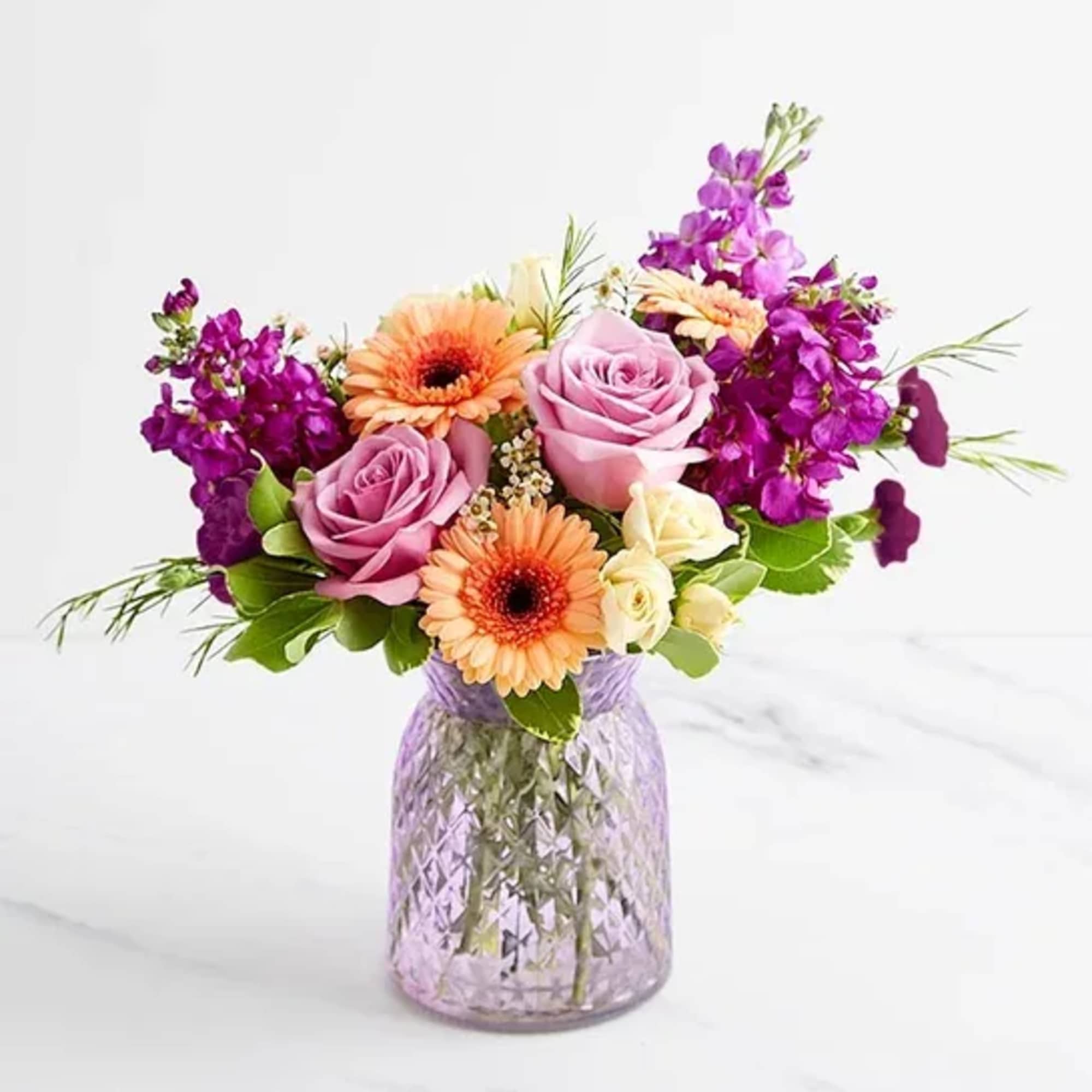 About Alluring Beauty&trade; Bouquet
NEW From its variety of blooms to its eye-catching