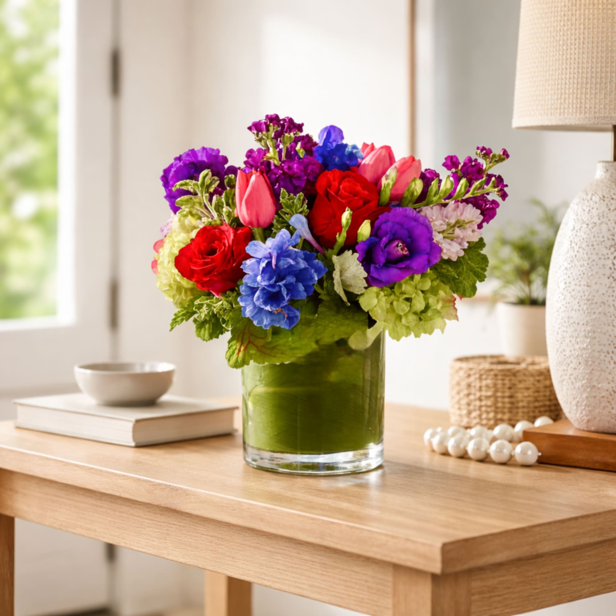 A treasure trove of vibrant blooms, the Jewel  Arrangement is a