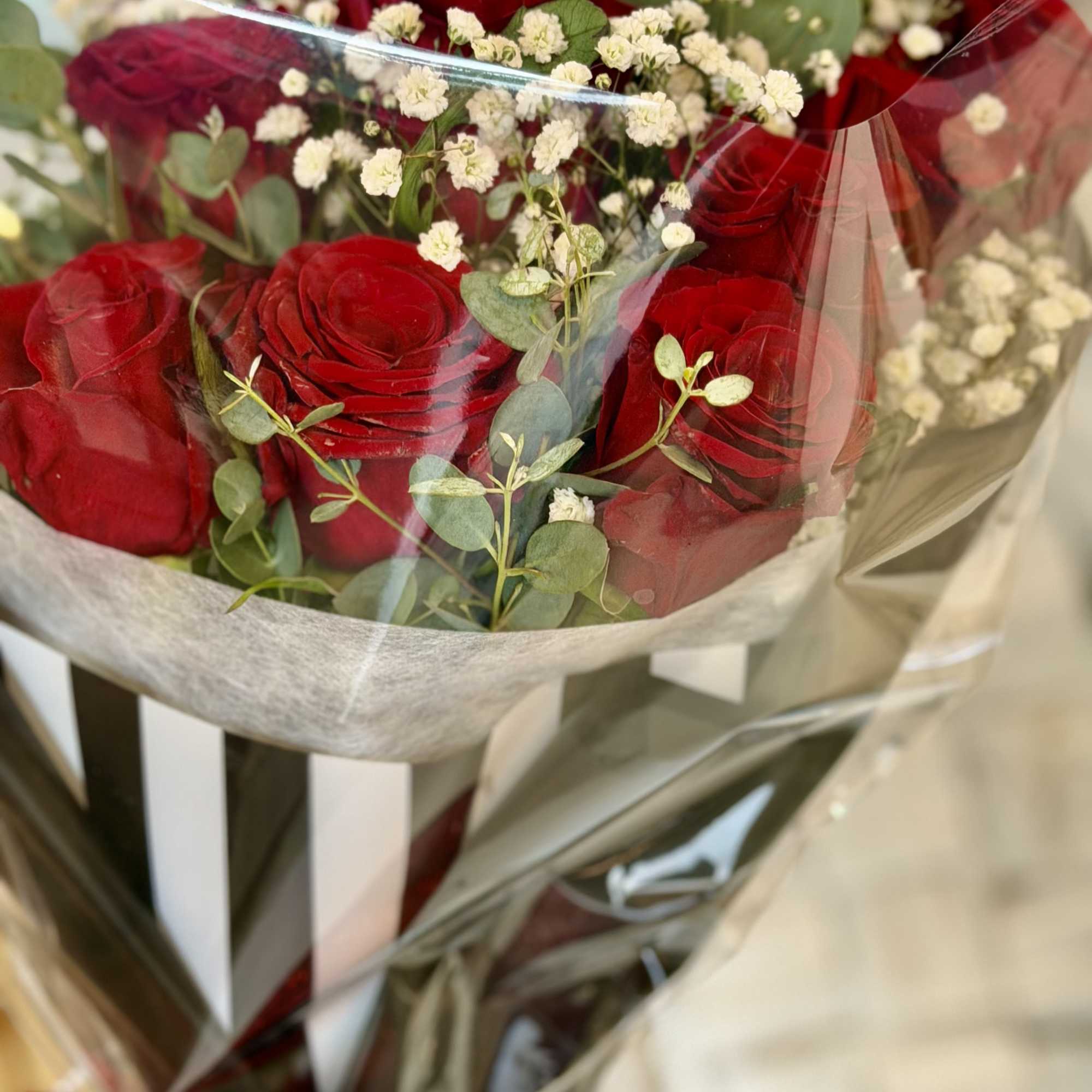 VALENTINE'S SPECIAL includes: 6 long steam red rose bouquet wrapped in lux