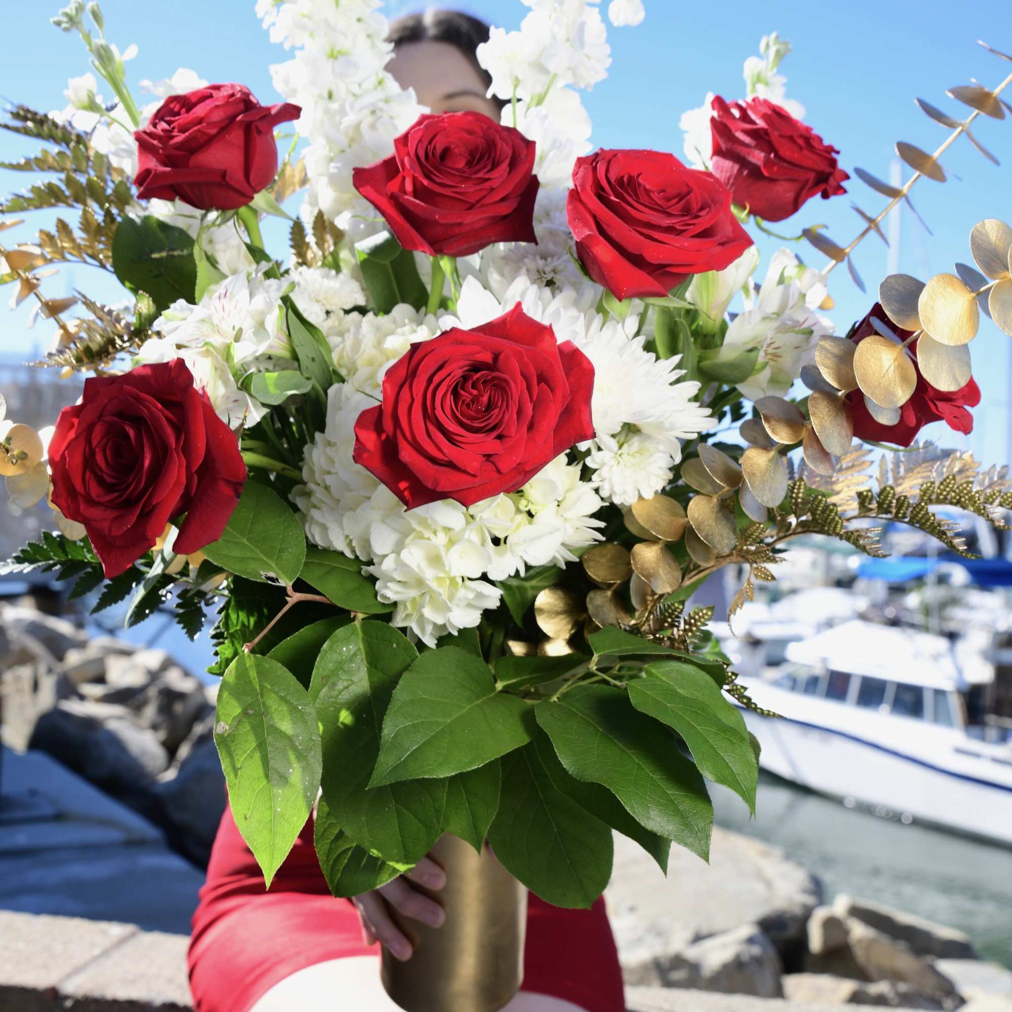 A tall arrangement filling all of the love with tons of red