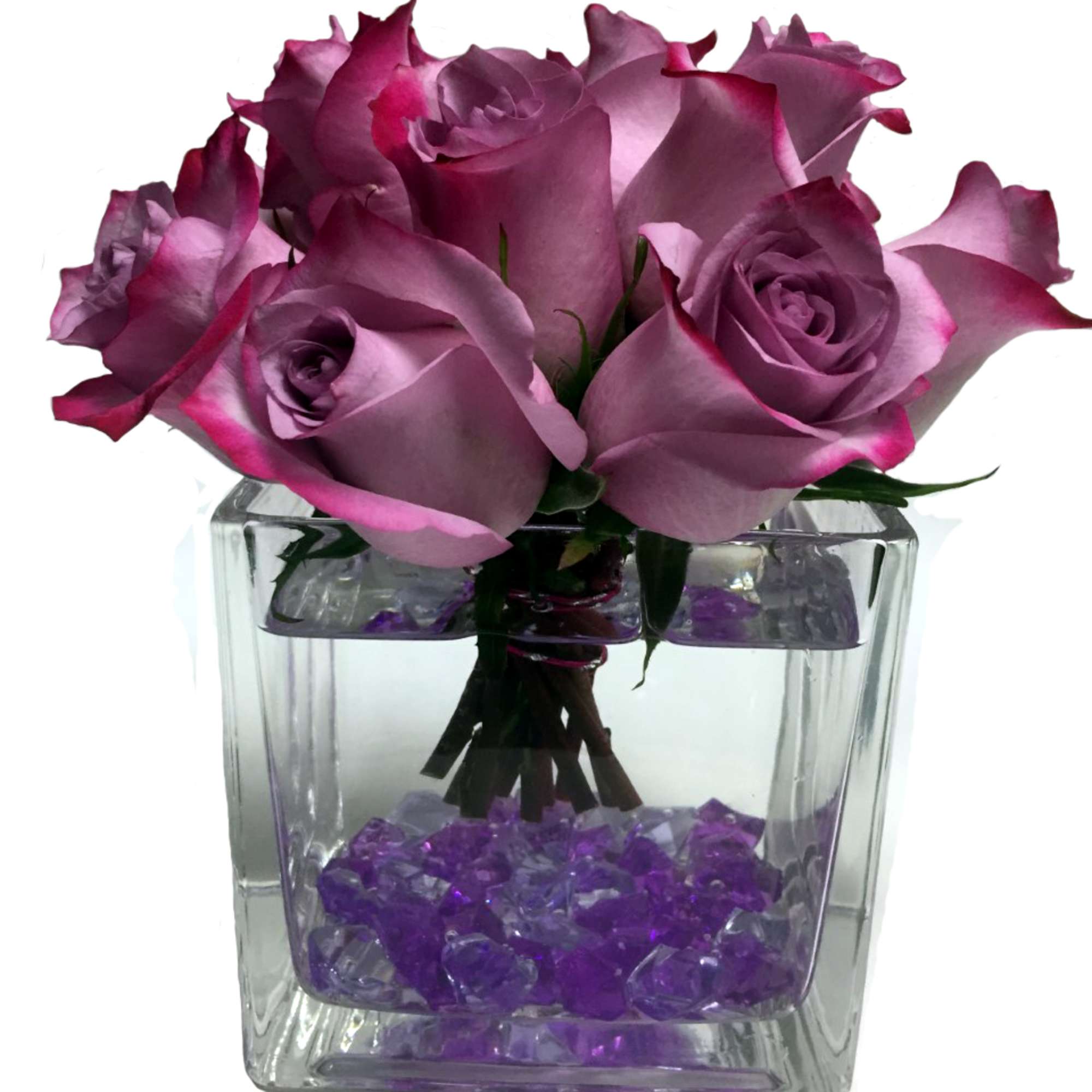 An enchanting bouquet of lavender roses sweetly touches her heart. Accented with