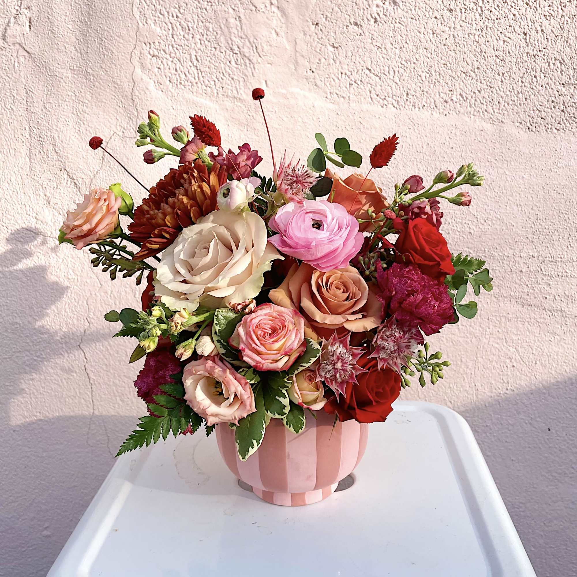 A sweet and thoughtfully designed floral arrangement, perfect for gifting to someone