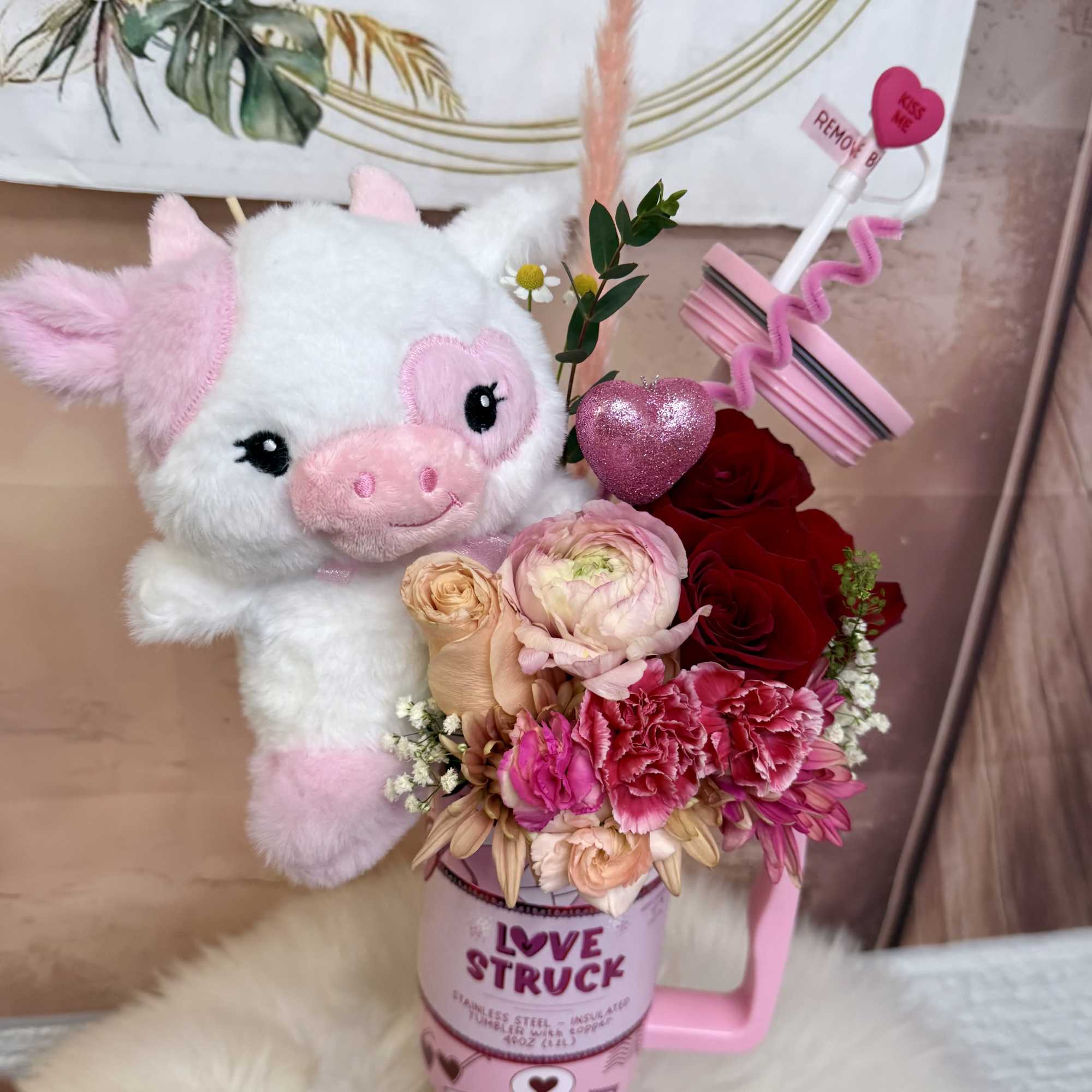 A sweet and charming floral arrangement presented in a modern, reusable &ldquo;Love