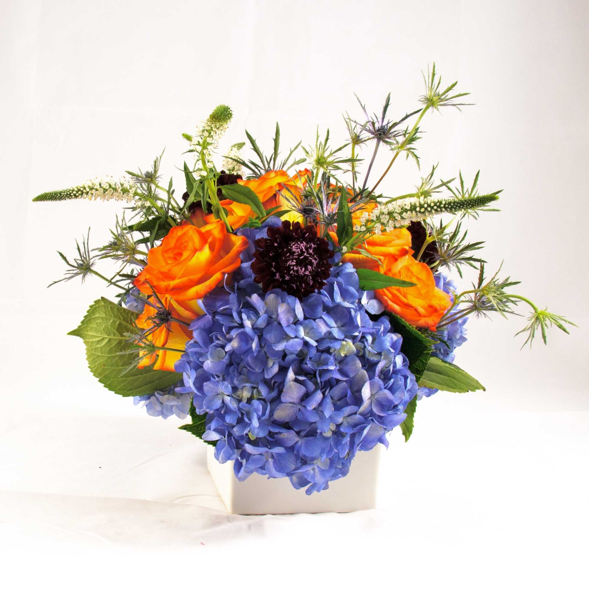 A bright and colorful low-compact arrangement for any special events, parties, birthdays