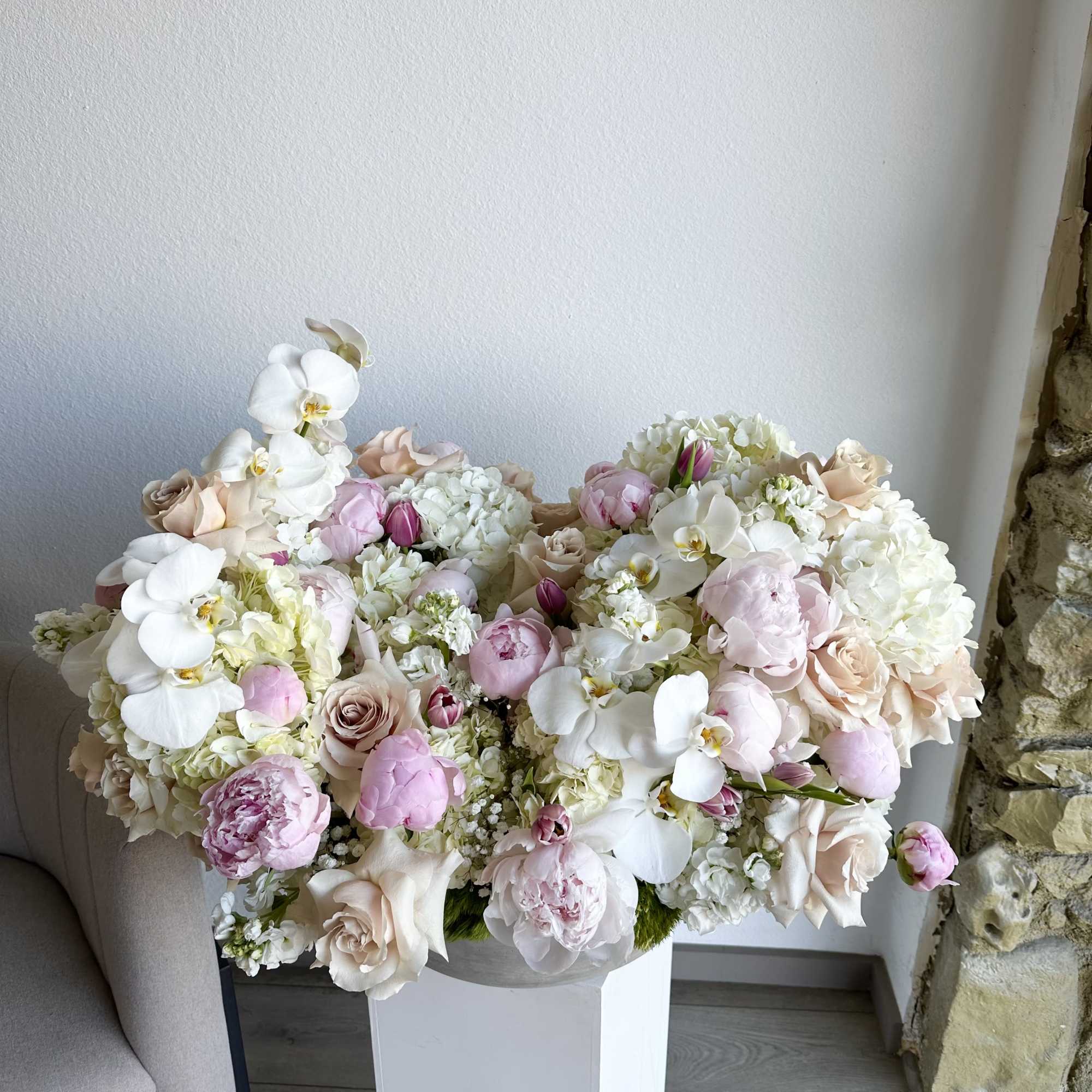 This Extra Large romantic arrangement includes roses, hydrangeas, peonies, orchids and greens.

Perfect