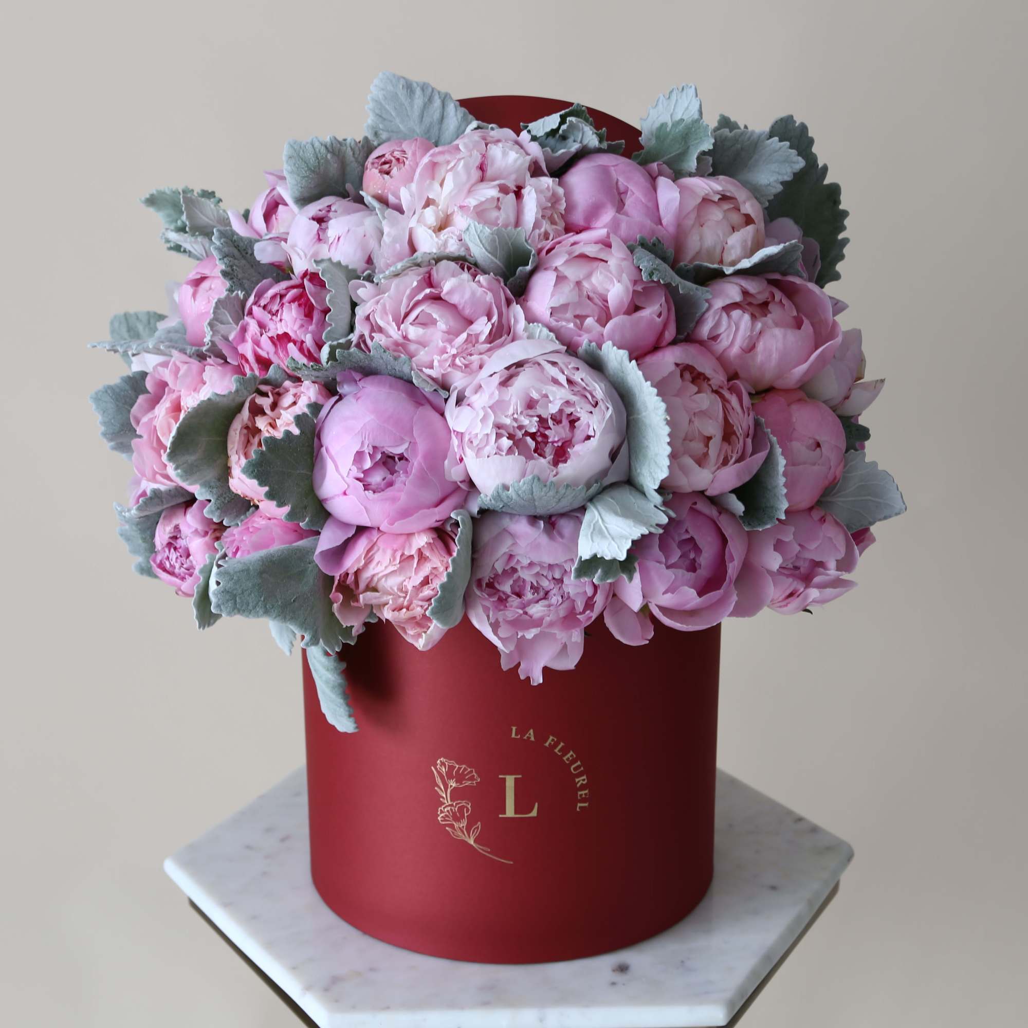 This gorgeous arrangement filled with the peonies and greens to deliver your