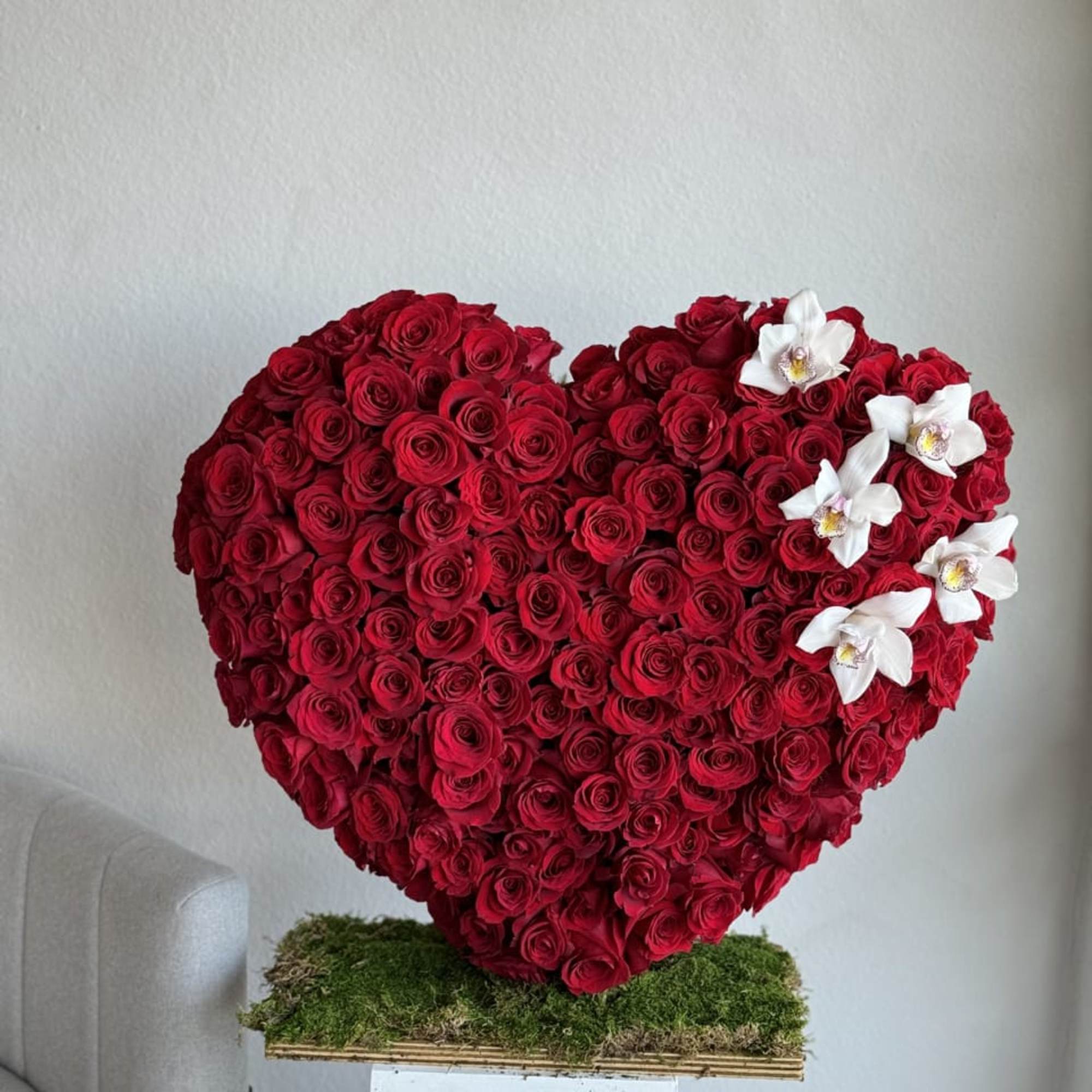 This beautiful arrangement filled with the 120- 150 red roses for SMALL