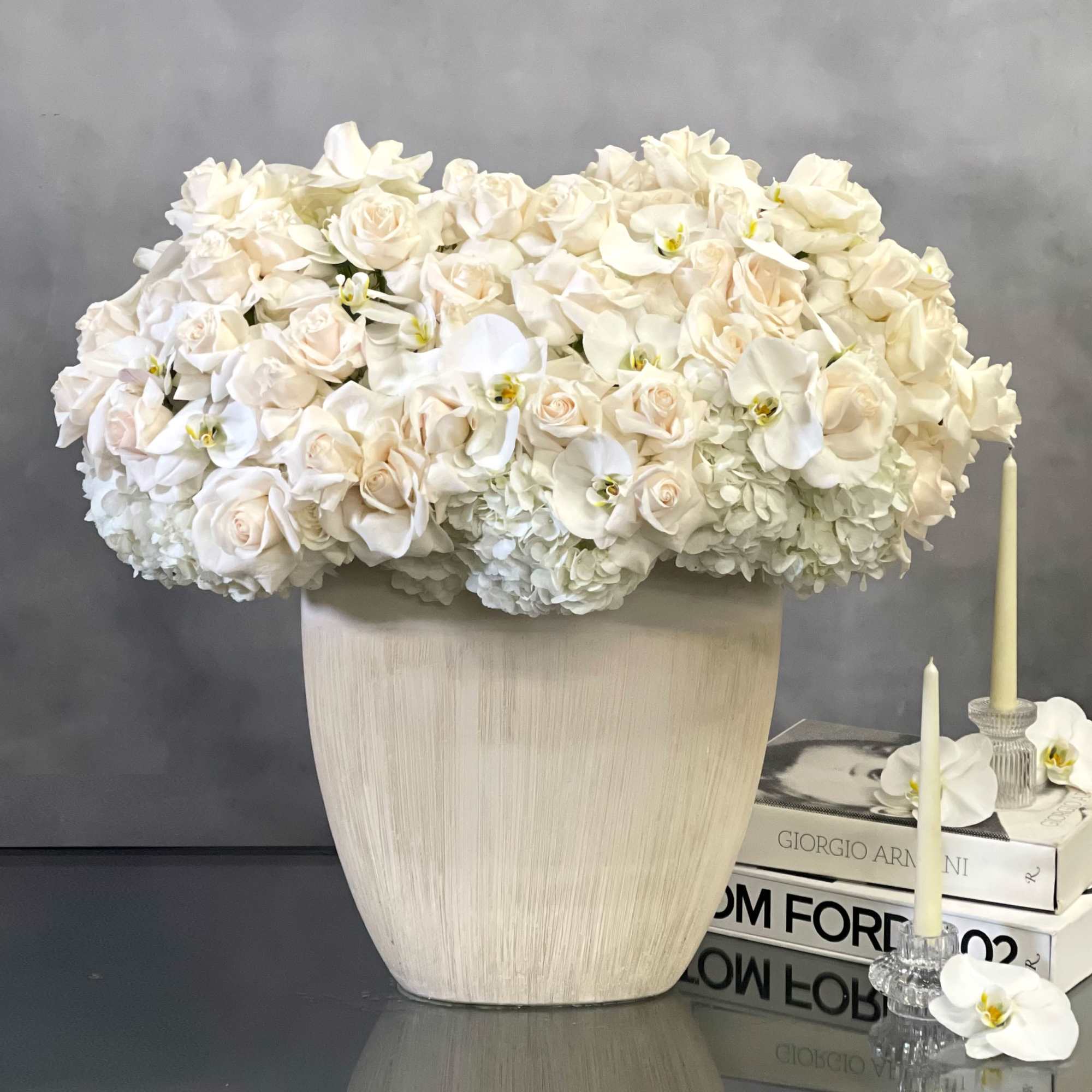 Beverly Hills Florist presents these stunning, over 100 specialty white Ecuadorian, orchids