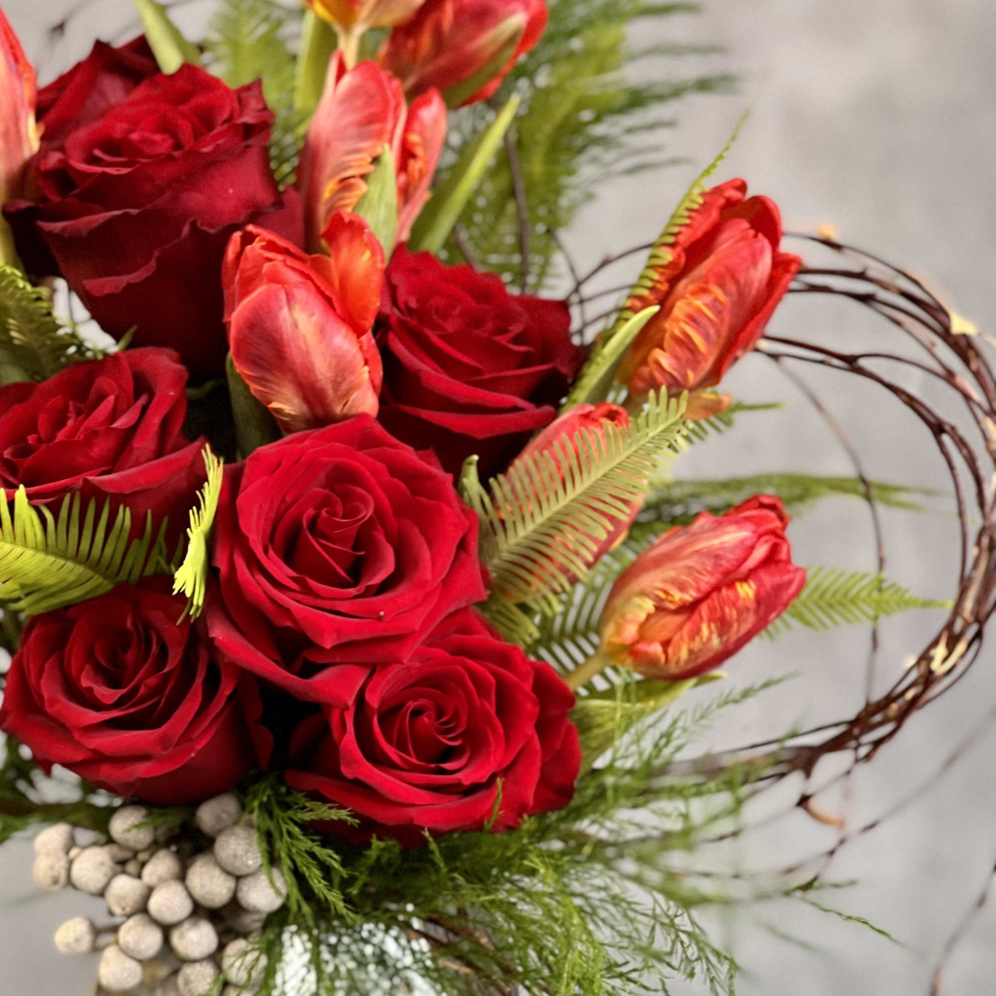 A Beautiful Display of Roses and Tulips with Burch Heart with Accents