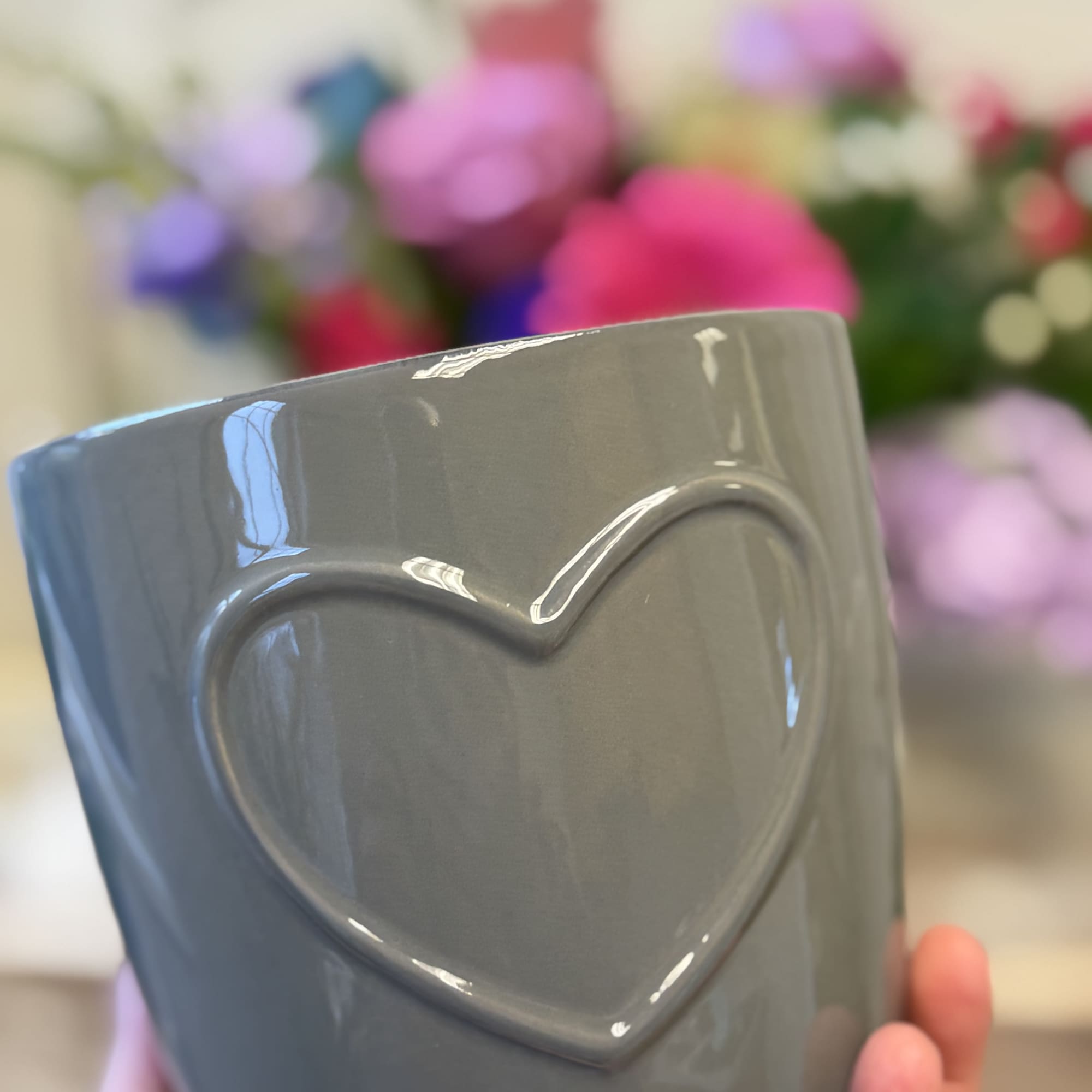 Send your sentiments with this adorable ceramic pot with a subtle heart